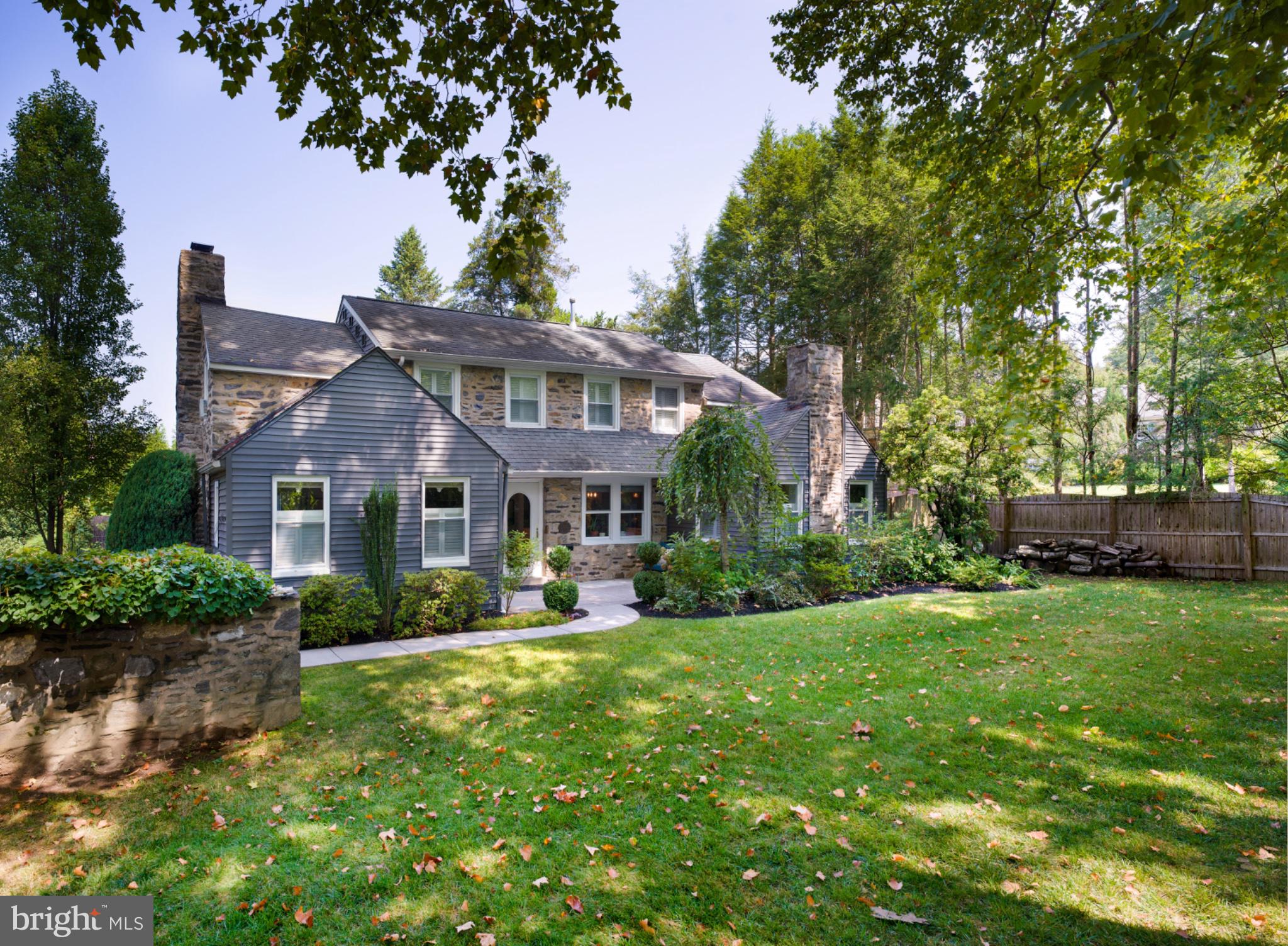 Nestled in the charming Green Hill neighborhood, this delightful colonial home exudes warmth and timeless elegance. Built in 1929, it features a blend of classic stone and wood siding, adding to its timeless appeal. As you step inside, discover the rich wood flooring that flows throughout, bright and open living space, a cozy fireplace that serves as a focal point in the inviting living area and an amazing open and airy kitchen which will sure to be the center of attention as it will become the centerpiece for your daily life. 
With four spacious bedrooms including two ensuites, a hall bath, as well as a hall bath in the lower level, there is plenty of space for all. The partially finished basement provides additional space for recreation and storage. 
The outdoor oasis features a large pool with extended patio and outdoor shower area, with privacy on every side as well as a beautiful covered area for outdoor entertaining, a small pond, and mature plantings. Experience the ultimate in luxury living, where every detail has been thoughtfully curated for an exclusive lifestyle.