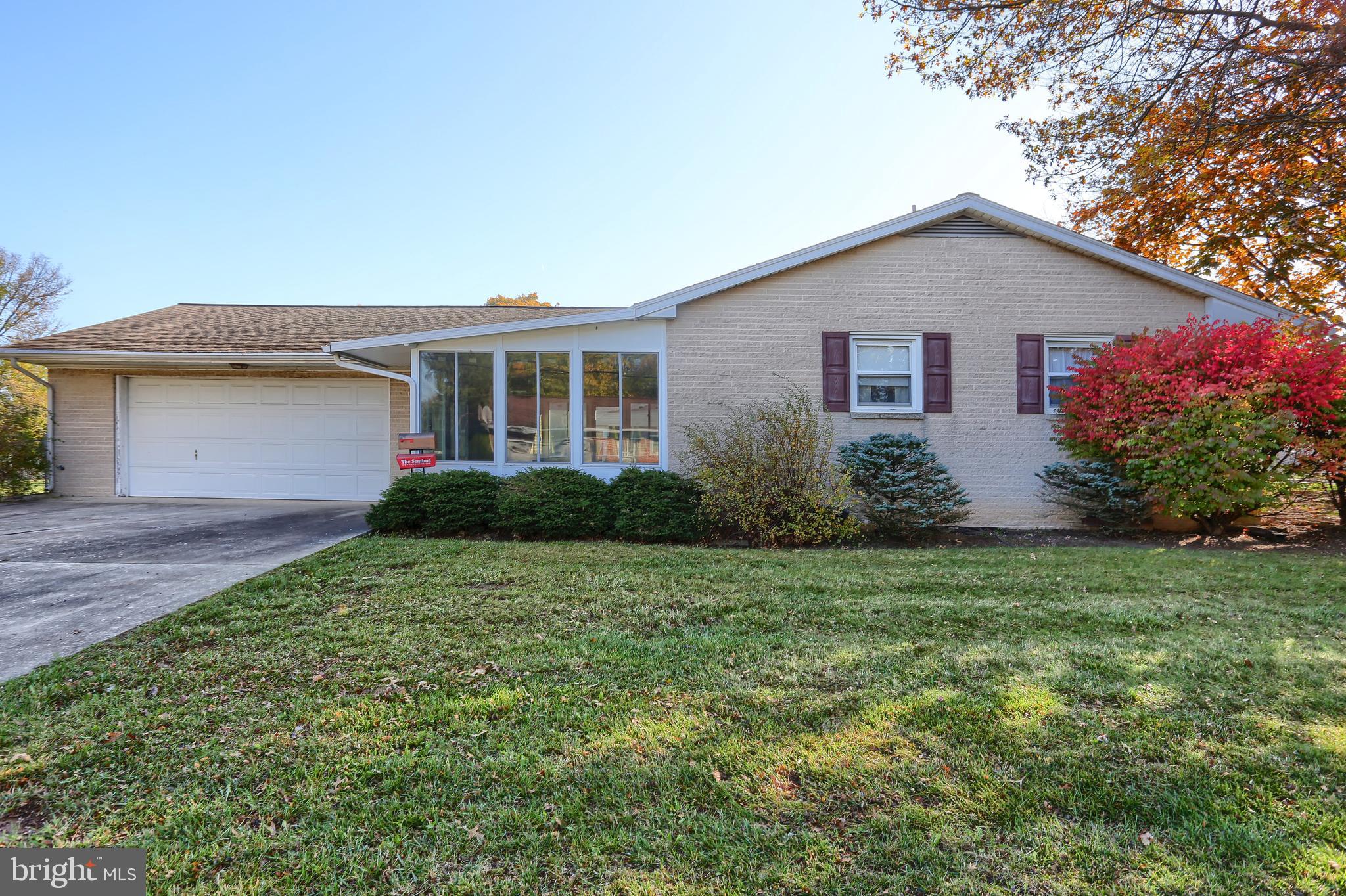 All brick ranch home on a corner lot in the Carlisle Borough. You'll enjoy the spacious living room with an impressive brick fireplace.  The kitchen boasts plenty of cabinets for storage, an eat- at countertop plus room for a dining table too. All appliances convey, including washer and dryer.  Sliding glass doors to enclosed breezeway  to garage for relaxing.   Two of the bedrooms have cedar closets. Bedrooms and living room have carpet but appears to have wood floors underneath, though not guaranteed.  Backyard is fenced. Basement has a 2nd brick fireplace too! Outside entry to basement and also a shower. Ideal  for pet grooming! Patio area behind garage.