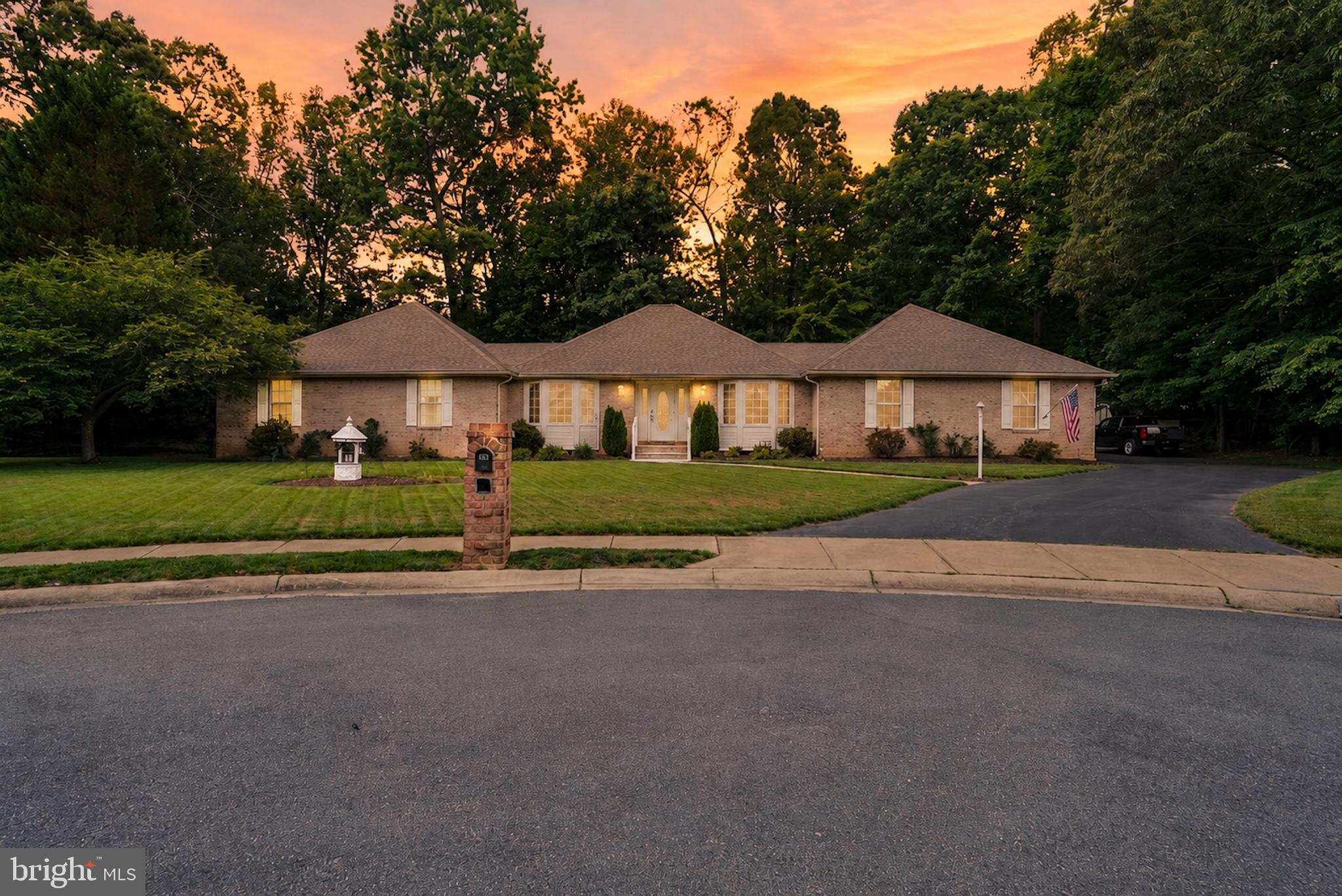 This sprawling one-level Rambler sits on a quiet cul-de-sac in the sought-after Kings Grant neighborhood, featuring a backyard oasis with an inground pool, expansive hardscape, and plenty of space for summer entertaining, while inside you’ll enjoy over 2,600 square feet of single-level living, a formal living and dining room flowing to a large family room with a gas fireplace and abundant natural light, an eat-in kitchen steps from a sunroom overlooking the landscaped backyard, a generous owner’s suite with a deluxe bathroom (soaking tub and separate shower), two spacious secondary bedrooms, could benefit from some flooring upgrades, but has great bones ready for your personal touch. Recent upgrades have been the HVAC and roof.  Convenient location with easy commuter routes to DC, Virginia, and local military bases. Also minutes from shopping, schools, library,  and the University of Maryland Charles Regional Medical Center.