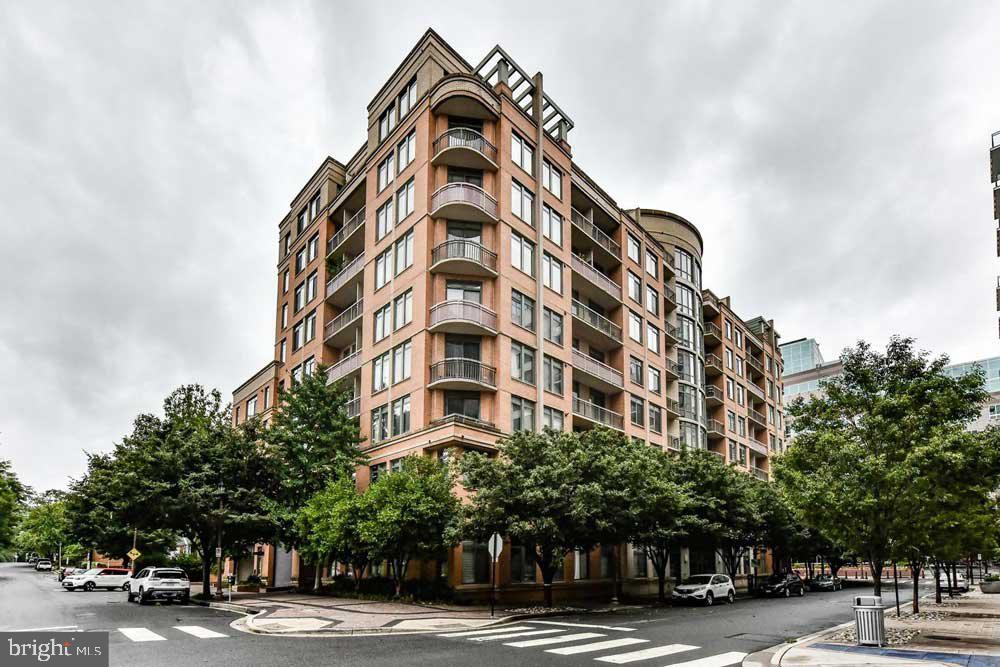 Live now! This is a true hidden gem in the sought-after Virginia Square Condominium—a spacious 2-bedroom + den just waiting for you! As you step inside, you'll be welcomed by beautiful wood floors and fresh paint throughout. The cozy fireplace sets the tone for a warm atmosphere, while the open floor plan includes a designated dining area perfect for gatherings. The upgraded kitchen features newer stainless steel appliances, plenty of counter space, and ample cabinetry for your convenience. Each bedroom is thoughtfully positioned on opposite sides of the unit, offering privacy and comfort, with its own walk-in closet and en-suite bathroom. The large den, framed by elegant glass doors, is a versatile space that can be used as an office, guest room, playroom, or whatever suits your needs. An in-unit washer and dryer make laundry effortless. Picture yourself enjoying a morning coffee by the fireplace or unwinding on the spacious balcony, which offers year-round enjoyment and even includes additional patio storage. This rental comes with an extra storage bin in the garage and the added bonus of two assigned parking spaces. Location couldn’t be better! You’re just steps from the Virginia Square Metro, restaurants, bars, shopping centers, Starbucks, and more. Don’t miss out—schedule your private tour today!