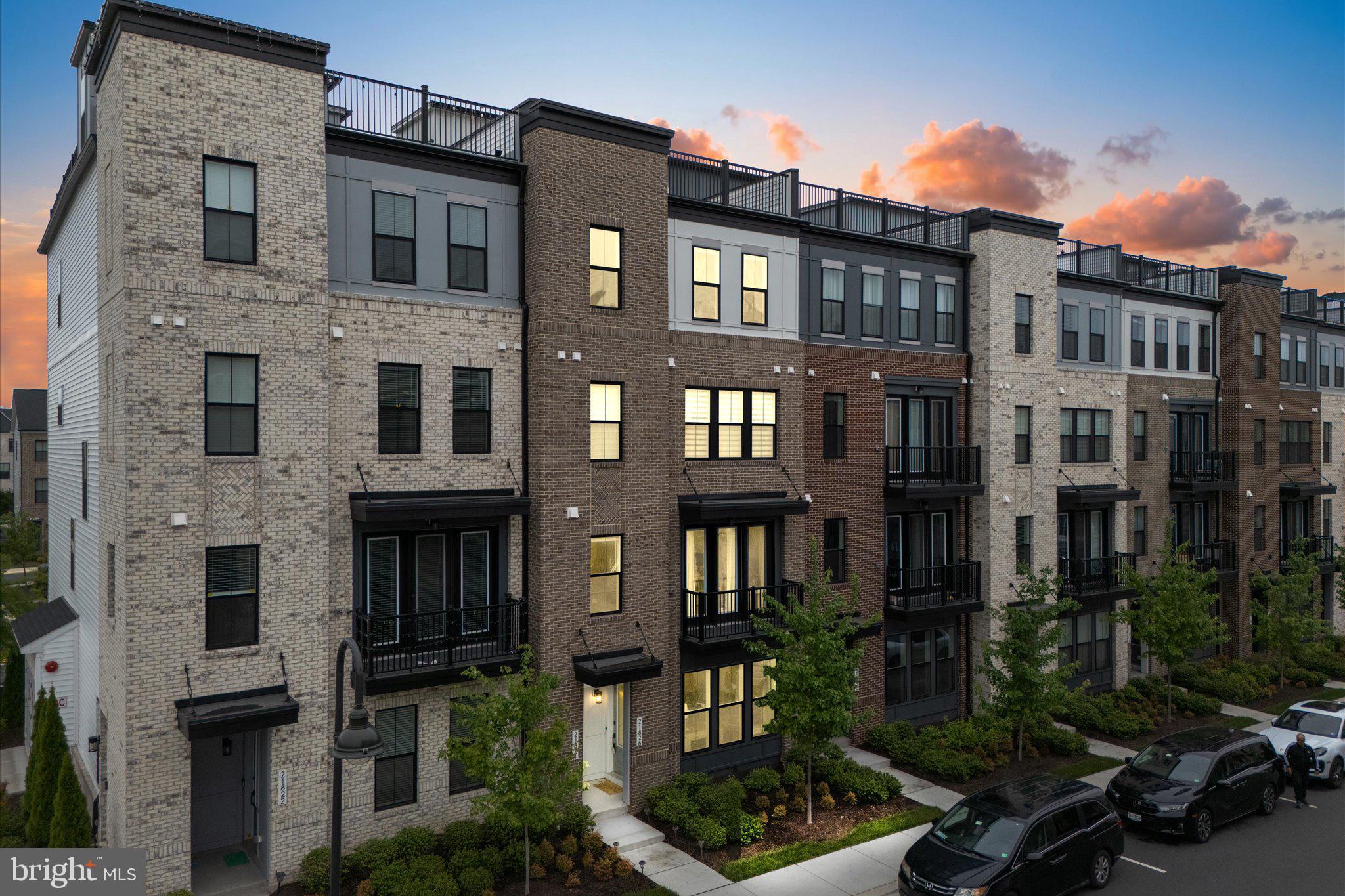 ****THIS IS NOT A STACKED UNIT!**** 4 FLOORS TOTAL WITH ROOFTOP! 
Welcome to this stunning townhome-style condominium—the Collier W/TR by Van Metre Homes—nestled in the highly sought-after Broadlands community. Offering 2,336 finished square feet across four thoughtfully designed levels, this nearly new home (just 3 years old) delivers the perfect blend of modern luxury, comfort, and low-maintenance living.
Step inside to discover 9-foot ceilings and a versatile entry-level recreation room, ideal for a home office, gym, or additional living space. This level also features a convenient half bath and direct access to the private, rear-load one-car garage.
The main living level is designed for both everyday living and entertaining, showcasing a beautifully appointed kitchen with upgraded cabinetry, quartz countertops, stainless steel appliances, and a large center island. The open-concept layout flows seamlessly into the dining and living areas, creating a bright and inviting atmosphere.
Retreat to the luxurious primary suite, complete with walk-in closets and a spa-like en-suite bath featuring dual vanities and an oversized frameless glass shower. Two additional bedrooms and a well-appointed full bath provide plenty of space for family or guests.
At the top, a true showstopper awaits—your private rooftop terrace. Whether hosting friends or enjoying a quiet evening, this space offers the perfect setting with expansive, scenic views.
Built with modern energy efficiency standards, this home offers peace of mind and cost savings. Beyond your front door, Broadlands delivers an exceptional lifestyle with access to multiple pools, a clubhouse, fitness center, tennis courts, scenic trails, and abundant green space.
Ideally located just minutes from shopping, dining, commuter routes, and Ashburn’s Silver Line Metro station, this home offers unmatched convenience in one of the area’s most desirable communities.
This is elevated, easy living at its finest—don’t miss it.