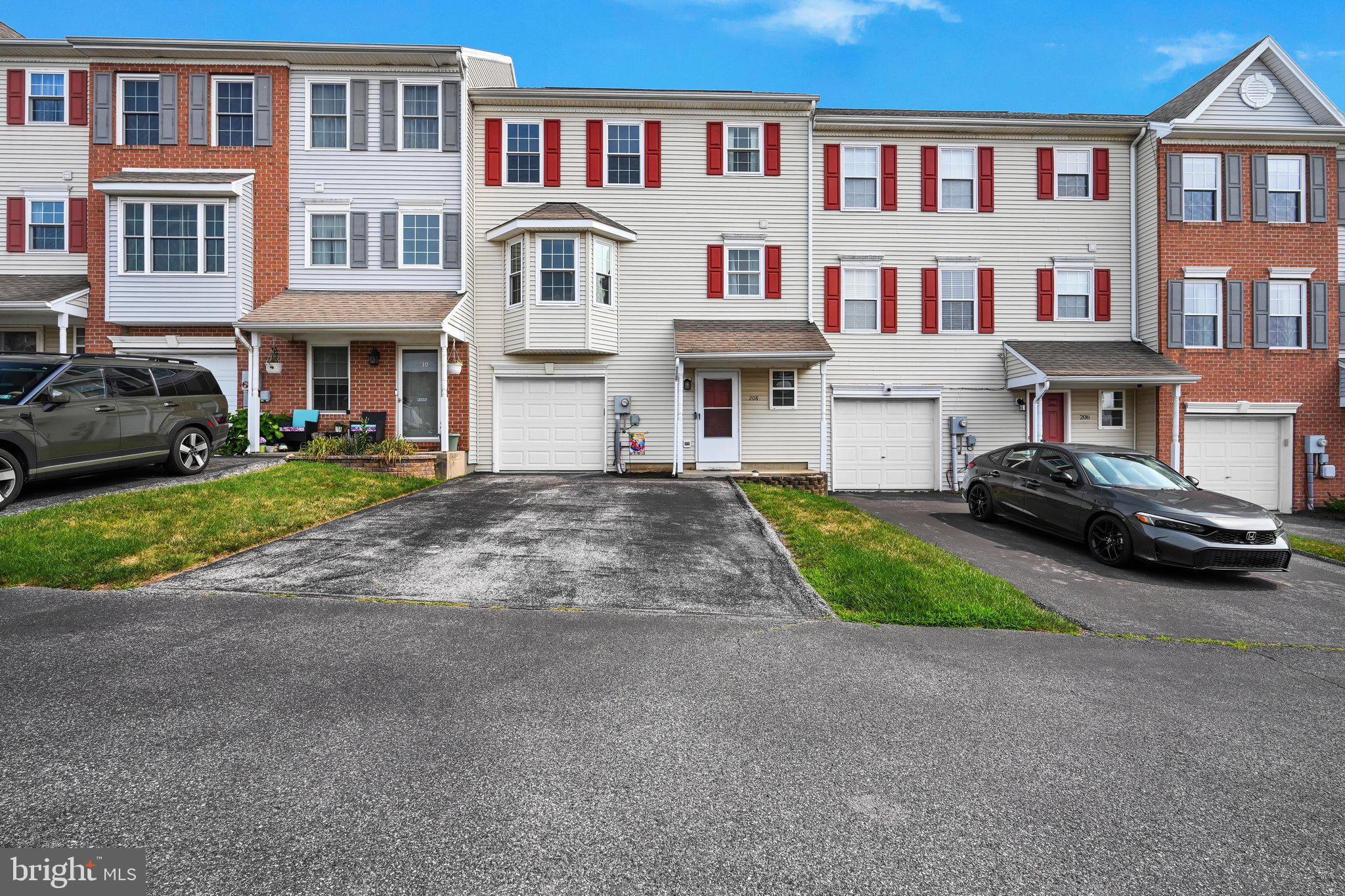 Welcome home to 208 Country Ridge Drive, Red Lion! This well-maintained 3-bedroom, 1.5-bath townhome offers comfortable living, practical updates, and an unbeatable location. Easy-to-maintain laminate plank flooring flows throughout most of the home, creating a clean, modern feel.

The bright kitchen features a refrigerator replaced in 2022 and opens through sliding glass doors to a lovely patio overlooking a level backyard—perfect for relaxing, grilling, or entertaining. Upstairs, you'll find three spacious bedrooms, including a primary bedroom with convenient pull-down attic access for additional storage. The oversized full bath offers a tub/shower combination and plenty of space for busy mornings.

The finished lower-level rec room provides valuable extra living space for a family room, home office, playroom, or fitness area. The basement also includes a utility room and an attached one-car garage. Additional parking is available in both the driveway and on-street for guests.

Major updates provide added peace of mind, including a new HVAC system installed in 2022, a 2022 kitchen refrigerator, and a newer garage door. Even better, the affordable monthly HOA fee covers lawn care and snow removal, giving you more time to enjoy your home.

Conveniently located just minutes from downtown Red Lion, you'll enjoy easy access to local restaurants, shopping, parks, and community events. Commuters will appreciate the quick drive to PA Route 24, PA Route 74, I-83, and US Route 30, making travel to York, Harrisburg, Lancaster, and Maryland simple. Outdoor enthusiasts can explore nearby Rocky Ridge Park, Nixon Park Nature Center, and the York County Heritage Rail Trail, while downtown York's dining, entertainment, and cultural attractions are just a short drive away.

It's important to note that the sellers will be installing a new roof prior to closing with an acceptable offer! Whether you're a first-time buyer, looking to downsize, or searching for a low-maintenance lifestyle, this move-in-ready townhome is one you won't want to miss.