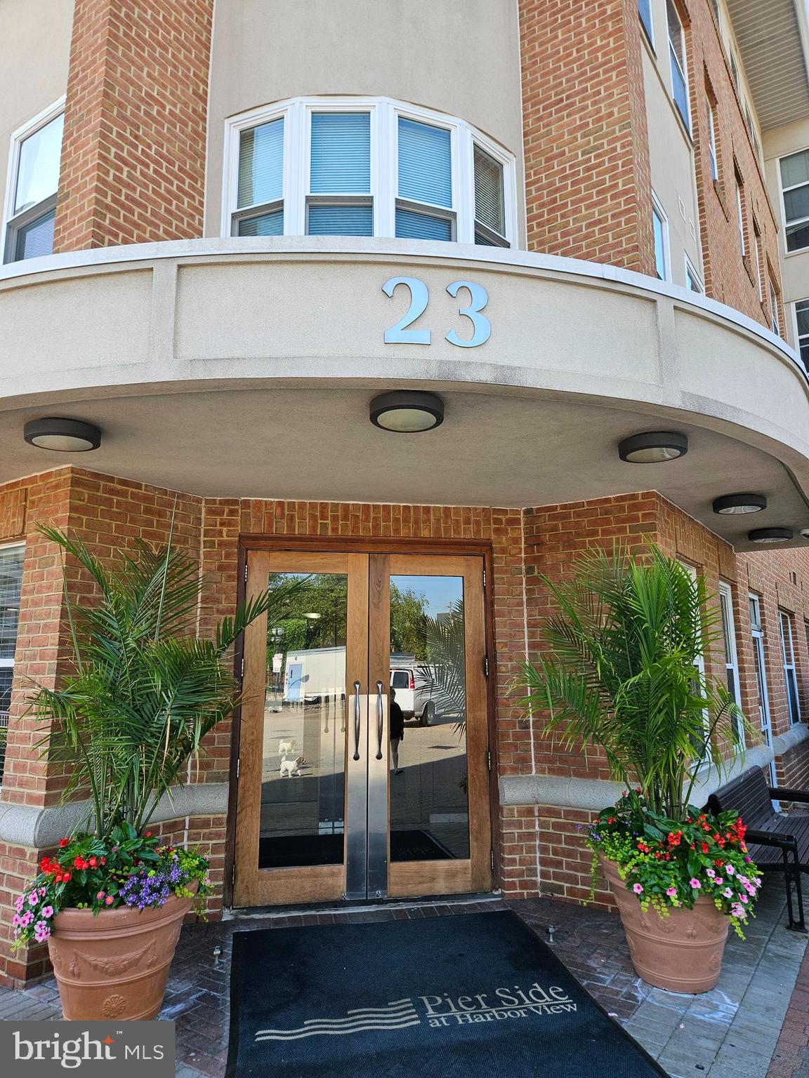 Experience the inviting charm of this 1-bedroom, 1-bathroom condominium in the highly desirable Harborview community of downtown Baltimore. This contemporary mid-rise residence seamlessly blends comfort, convenience, and the allure of waterfront city living. Step into an open-concept living and dining area, thoughtfully designed for both relaxation and entertaining. Expansive windows flood the home with natural light and frame breathtaking views of the harbor and city skyline. Throughout the living space, engineered wood flooring adds warmth and modern sophistication. The well-appointed kitchen features modern appliances—including a built-in microwave, dishwasher, and electric oven/range—making everyday cooking a pleasure. For added convenience, the unit includes a stacked washer and dryer. Residents benefit from a suite of community amenities: 24-hour concierge service and monitored security, an outdoor swimming pool, a fully equipped fitness center, and beautifully maintained common areas. Additional highlights include one assigned parking space in a secure detached garage, as well as access to professionally maintained grounds. Set in vibrant downtown Baltimore, this home is just steps from waterfront dining, shopping, entertainment, and Inner Harbor attractions. Embrace the ideal blend of urban convenience, stunning waterfront views, and resort-style living in this exceptional Harborview condominium.