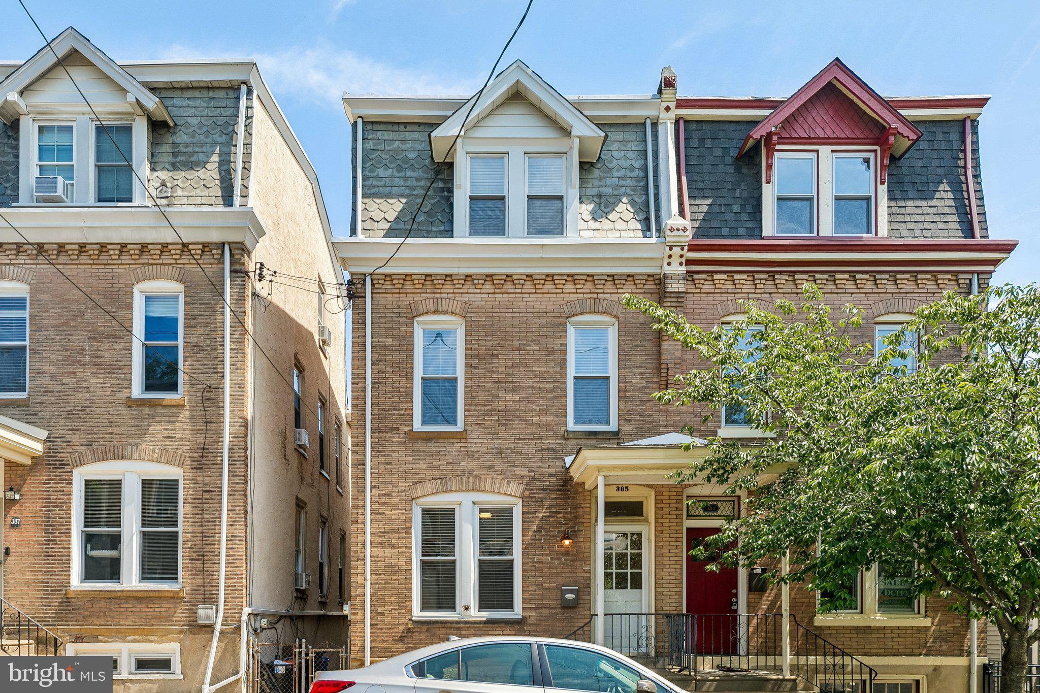Welcome to 385 Conarroe — a spacious twin tucked along a charming tree-lined street just blocks from the heart of Manayunk. The open-concept first floor living area impresses with hardwood floors, tall ceilings, and oversized windows that flood the space with natural light. There is a formal dining area just off the updated kitchen with granite countertops, tall cabinetry, stainless steel appliances, and a tumbled travertine backsplash. Out back, a perfectly sized yard invites weekend grilling, a garden, or simply enjoying the fresh air. Upstairs across two floors, five well-proportioned bedrooms each offer hardwood floors, ceiling fans, and abundant light. Two full bathrooms with upgraded finishes complete the home. All of this — just a short walk to Main Street’s restaurants and shops, and steps from the train.