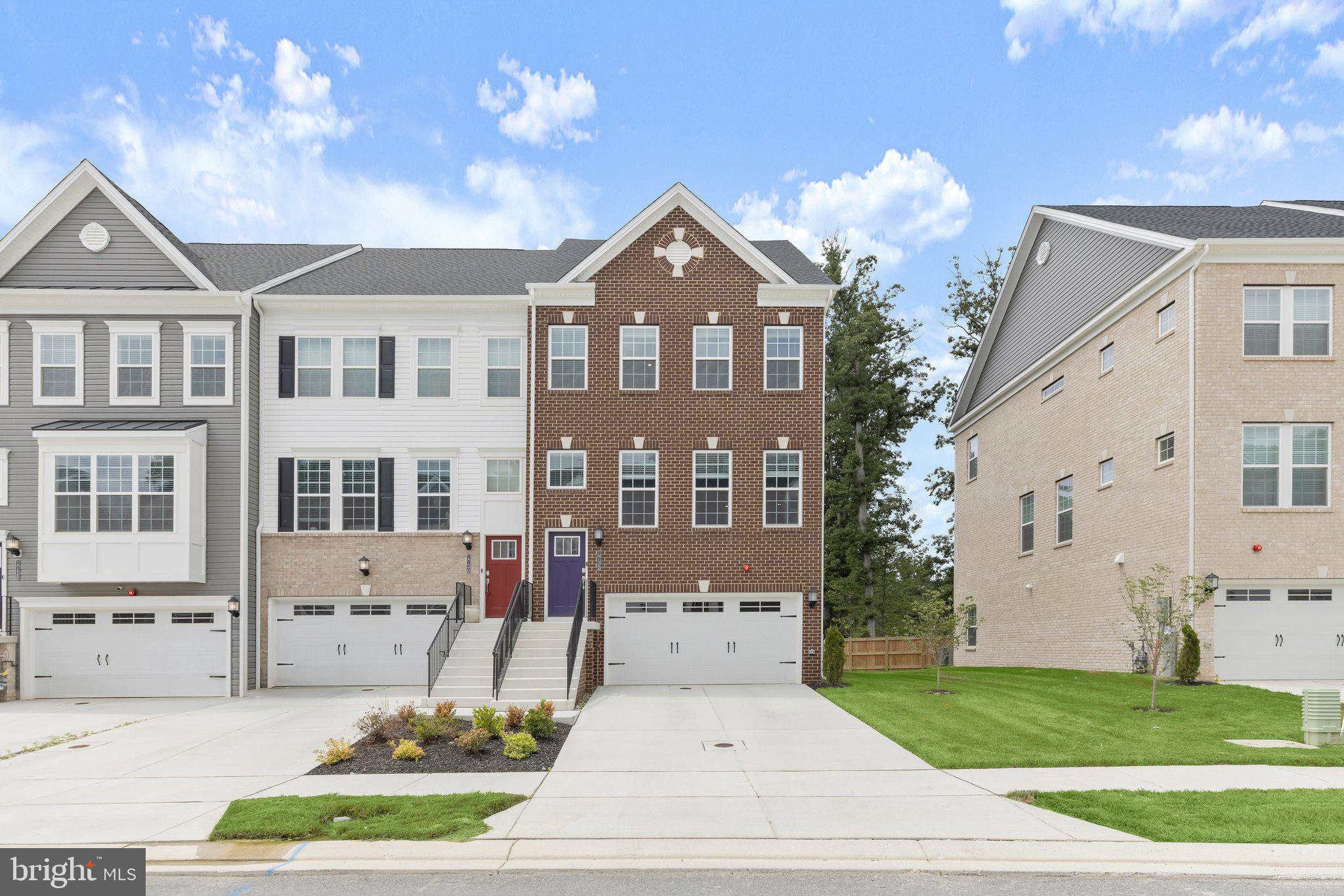 Introducing the first resale opportunity in the sold-out Fairways at Woodholme community, this exceptional end-of-group Lennar townhome offers the rare chance to own nearly new construction. Built in 2025 and backing to a peaceful wooded forest conservation area, this four-level home features over 2,400 square feet of thoughtfully designed living space with three bedrooms, three full bathrooms, two half bathrooms, and a two-car garage, plus a driveway accommodating four additional vehicles. Inside, abundant natural light, a modern neutral color palette, and upscale finishes create a bright and inviting atmosphere throughout. The open-concept main level showcases luxury vinyl plank flooring, crown molding, recessed lighting, an inviting front living room, and a spacious dining area with sliding glass doors leading to the rear deck overlooking the serene wooded backdrop. At the heart of the home, the gourmet kitchen is beautifully appointed with quartz countertops, a massive island with seating, soft-close 42-inch shaker cabinets, a tile backsplash, a walk-in pantry, an additional beverage bar, and stainless steel appliances including a gas cooktop and double wall oven. A conveniently located half bathroom completes the main level. Upstairs, the luxurious primary bedroom suite offers a walk-in closet and an en-suite bathroom featuring a frameless glass walk-in shower with a built-in bench, a dual sink vanity, and a private water closet. Two additional bedrooms share a full hall bathroom, while the upper-level laundry room adds everyday convenience. The top floor provides even more flexible living space with a loft, a half bathroom, and access to a spectacular rooftop terrace that is perfect for relaxing or entertaining. The finished lower level expands the home's versatility with a massive recreation room, a full bathroom, sliding glass doors leading to the backyard, and access to the two-car garage. Combining modern design, exceptional space, and a premier location in one of the area's newest and most desirable sold-out communities, this is an opportunity not to be missed.