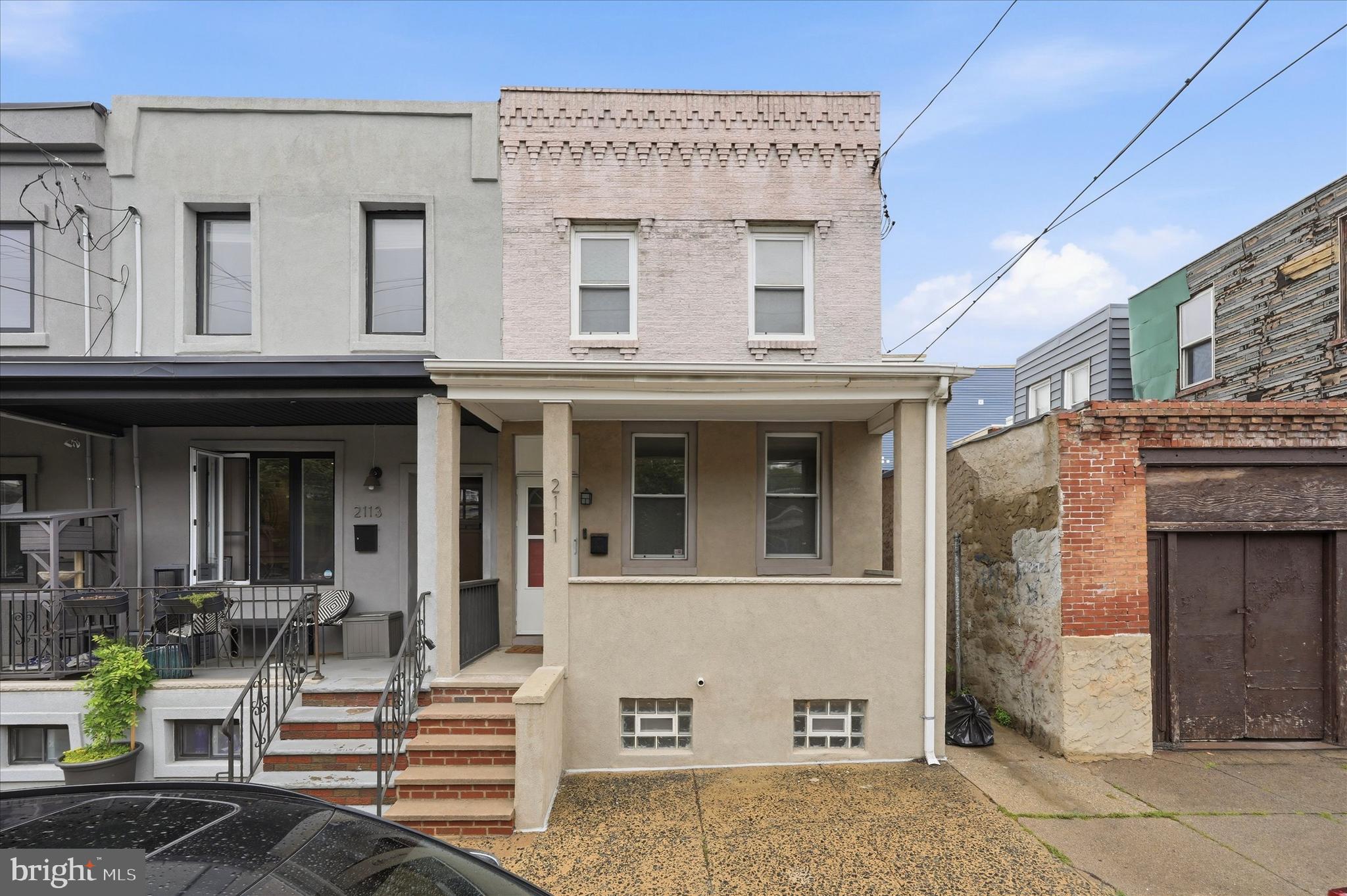 Welcome to 2111 Wharton Street, a charming 3-bedroom, 1.5-bath end-unit rowhome located in the heart of Point Breeze. This well-maintained property blends classic Philadelphia character with modern updates and functional living space throughout.

Step inside to find a bright and spacious open-concept living and dining area featuring warm hardwood-style flooring, recessed lighting, and plenty of natural light. The updated kitchen offers rich wood cabinetry, granite countertops, stainless steel appliances, subway tile backsplash, and ample prep space for cooking and entertaining.

Upstairs, you’ll find three comfortable bedrooms and a full bath, while the lower level provides additional storage and convenient laundry access. Enjoy your morning coffee on the covered front porch or unwind in the private backyard patio — perfect for grilling, gardening, or relaxing outdoors.

Conveniently situated near local cafes, parks, shopping, and public transportation, this Point Breeze gem offers city living with neighborhood charm.