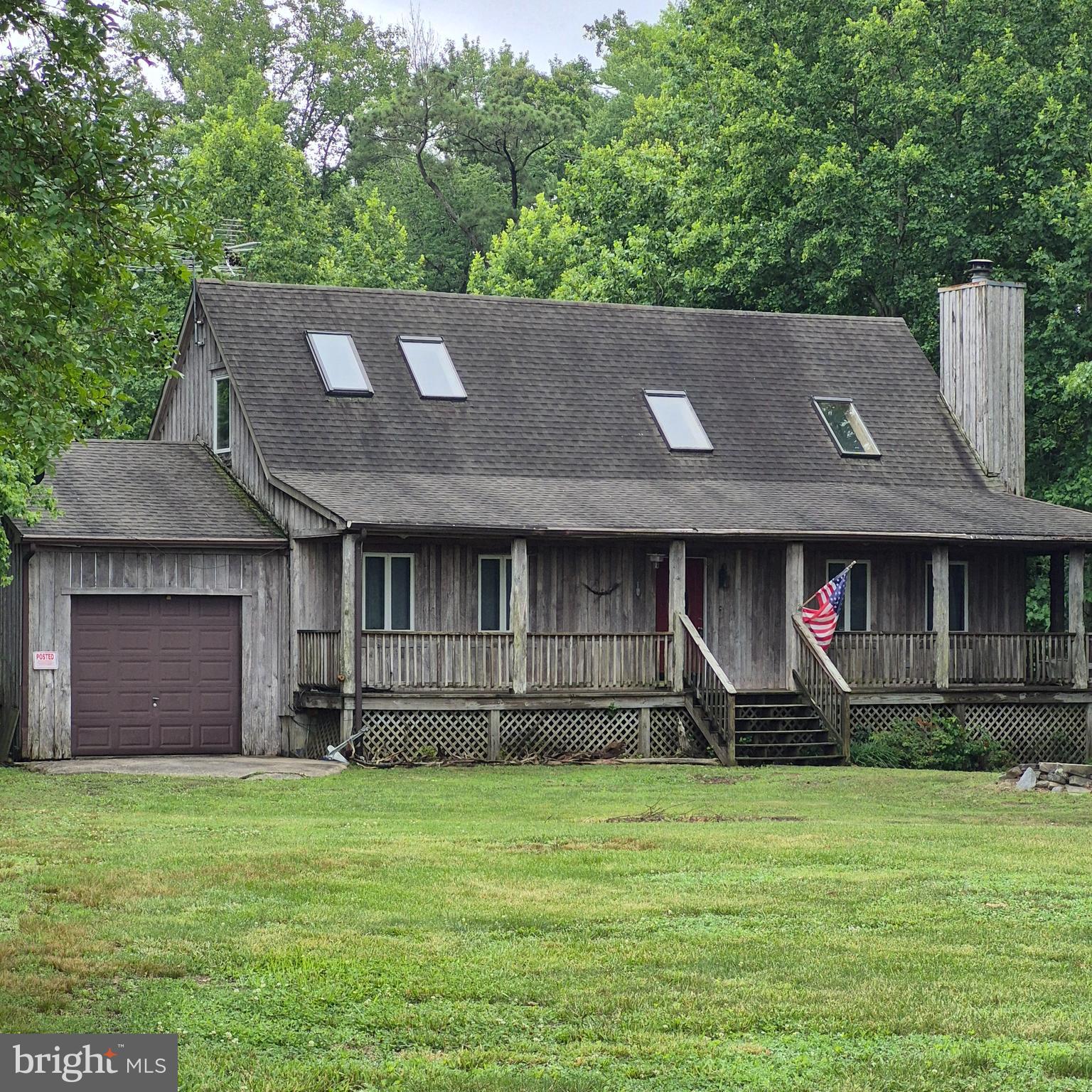 Nice cedar sided home on 2 1/2 mostly wooded acres in a very small subdivision with community dock and ramp on Hull Creek with controlling access to the Potomac River and Chesapeake Bay.  There are attached and detached garages, in ground pool, extensive decking and conveying hotbtub and pool table in full finished basement.  Main floor master and open floor plan, wraparound deck, loft with bedroom, stone driveway, artesian well.  The pool and some siding need a little love, but this is an opportunity for those that love nature and the outdoors.