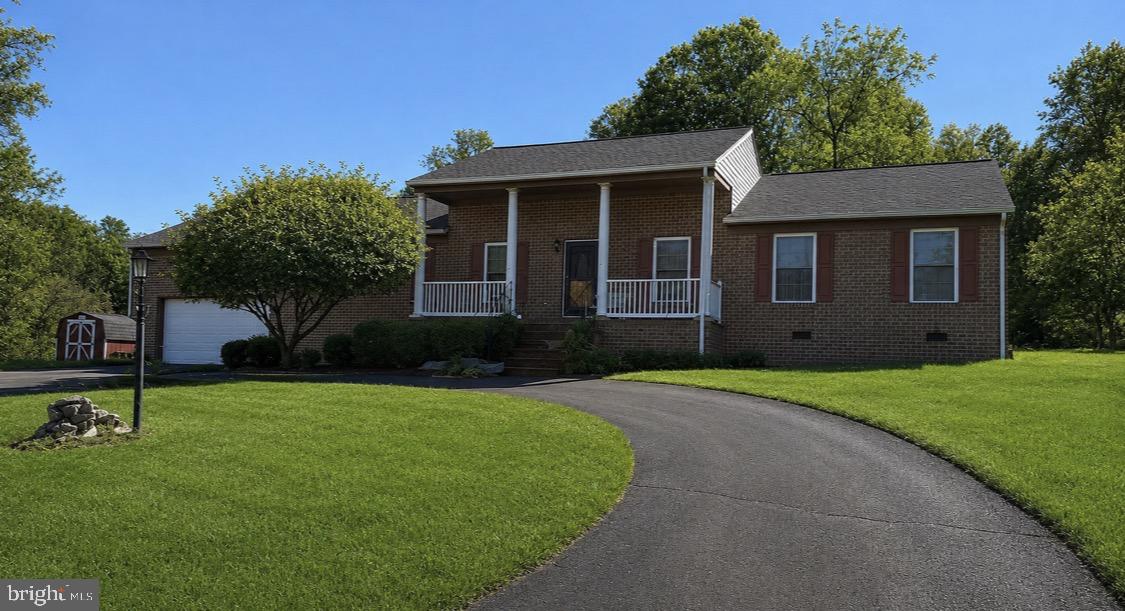 Nestled on a serene 2-acre lot, this exquisite ranch-style home, built in 2006 and set to undergo a major renovation in 2026, offers a perfect blend of luxury and comfort. The exterior showcases a charming brick front and durable vinyl siding, creating an inviting first impression. As you step inside, you are greeted by an open floor plan that seamlessly connects the living spaces, ideal for both entertaining and everyday living. The heart of the home is the spacious family room, which flows effortlessly into the dining area and kitchen, making it perfect for gatherings. Recessed lighting casts a warm glow throughout, highlighting the upgraded countertops and the sleek stainless steel appliances, including a gas range, built-in microwave, and energy-efficient dishwasher. The kitchen also features a cozy table space, perfect for casual meals or morning coffee. This residence boasts four generously sized bedrooms, including a convenient entry-level bedroom that offers flexibility for guests or a home office. The primary suite is a true retreat, complete with a walk-in closet and an en-suite bathroom featuring modern fixtures and finishes. The home's interior is adorned with a harmonious mix of hardwood, ceramic tile, and plush carpeting, providing both elegance and comfort underfoot. A gas fireplace in the family room adds a touch of warmth and ambiance, making it the perfect spot to unwind after a long day. Step outside to discover a delightful deck and porch area, ideal for enjoying the tranquil surroundings or hosting summer barbecues. The expansive yard offers endless possibilities for outdoor activities, gardening, or simply soaking in the beauty of nature. With a two-car attached garage and a circular driveway, parking is a breeze. The property also includes a shed for additional storage, ensuring that everything has its place. This home is not just a residence; it's a lifestyle. Experience the perfect blend of luxury, comfort, and tranquility in a setting that feels like a private retreat while still being close to all the conveniences you desire. Embrace the opportunity to make this exceptional property your own and enjoy the exclusive lifestyle it offers.
