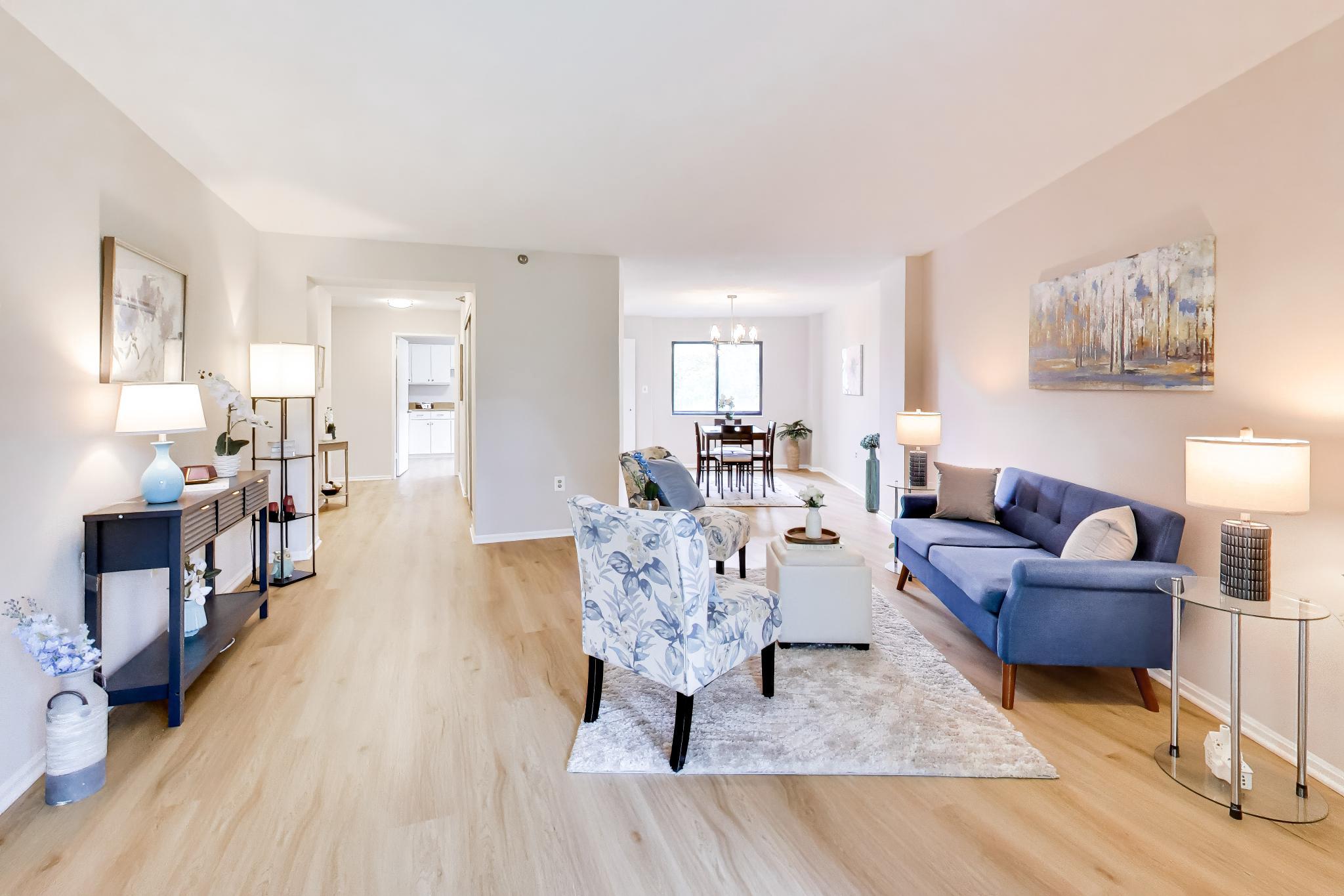 Welcome to Your New Home! Step into the ease of condominium living at Maryland’s favorite destination for 55+ active lifestyles: The Greens at Leisure World. This freshly painted condo features beautiful luxury vinyl plank flooring and plush carpeting. It’s ready for you to call home! Enjoy a spacious Living Room that opens into a bright and cozy Sunroom with views of lush greenery and the Leisure World Golf Course.  The Dining Room is warm and inviting, featuring a tasteful contemporary chandelier and plenty of room for a large dining table, sideboard, and china cabinet, making it ideal for entertaining. The Kitchen is both stylish and functional, equipped with freshly painted white cabinets, new stainless-steel appliances, and a convenient stacked washer/dryer neatly tucked into the Laundry Nook. You'll also love the roomy Pantry for all your storage needs. Retreat to the large Master Suite, which offers a dressing area and vanity, two closets—including a spacious walk-in—and a full bathroom. Bedroom #2 is versatile and can serve as an office, study, or guest room, complete with a closets and its own full bathroom featuring a step-in shower. Additional storage? No problem!  A spacious Storage Cage on the Basement Level is perfect for keeping items on hand for future use. Unit location is key in this condo, located at the far end of the hall, you’ll enjoy perhaps the quietest condo in the building. The elevators, trash and recycling room, are steps away. Parking is a breeze with ample spaces for residents and guests, including plenty of handicap-accessible spots near the entrance. And the amenities? They’re second to none! You’ll have access to resort-style amenities including two Clubhouses, two Restaurants, Indoor and Outdoor Pools, a Fitness Center, Library, Theater, and countless clubs, organizations, and walking paths. Need to get around? Leisure World Transportation provides free bus service throughout the community, including the golf course, clubhouses, MedStar Health Medical Center, churches, and the new Administration Complex, as well as to local shopping, dining, and more. Bring your imagination and see just how beautifully your belongings will fit into this welcoming condominium. Your new lifestyle awaits you at The Greens at Leisure World!