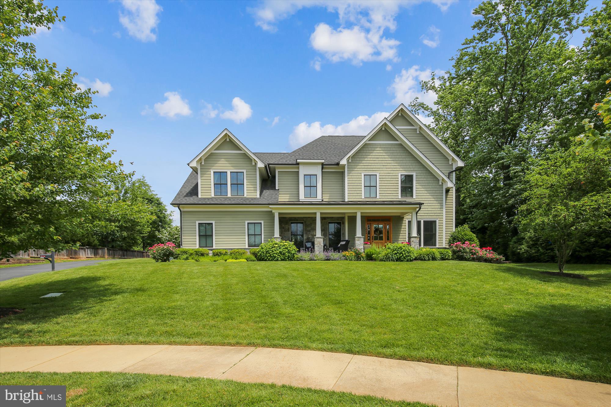 Welcome to Chesterbrook Manor: a cul-de-sac of 12 properties built in 2013 by Madison Homes.  Spacious rooms, thoughtful floorplan, and high end finishes throughout. The home sits at the top of the cul-de-sac and begins with a spacious covered stone front porch, perfect for enjoying all of the natural sun the home soaks in! The center foyer has the living room on the right, and a spacious dining room on the left. The main level also features hardwood floors throughout, a large white shaker cabinet kitchen, granite counters on the perimeter, quartzite counters on the spacious island with seating and storage, bonus sink, Jenn Air appliances, 6-burner gas range, beverage center, two ovens, recessed lighting, and command center desk area. The kitchen has table space for an everyday eating area, which overlooks the family room with gas fireplace, door to the Trex deck, patio, and pergola with ceiling fan and bistro lights.  More features on the main level include a main level office with French doors near the family room, a mudroom with cubbies from the 2-car garage with a coat closet, butler pantry,  another coat closet and powder room. On the upper level you'll find a spacious primary bedroom suite with sitting area, 2 walk-in closets, a huge bathroom with soaking tub, glass enclosed shower with multiple shower heads, separate vanities, water closet, and private linen storage. Each of the three secondary bedrooms has an en-suite bath and walk-in closet. There is a laundry room upstairs with bonus sink, cabinets for storage, and counter top for folding or storage. The basement level has a spacious rec room with shiplap decorative wall, 5th bedroom with walk-in closet and en-suite bath, a huge unfinished storage area, and a flex space currently used a gym. There is an exit with walk-up stairs to the side yard. Chesterbrook Manor feeds to Franklin Sherman, Longfellow and McLean HS. Enjoy easy access to McLean Swim and Tennis or Chesterbrook Swim, downtown McLean, Kent Gardens Park, Giant, Safeway, Starbucks, and multiple restaurants. Easy commuting with access to all the major roadways.