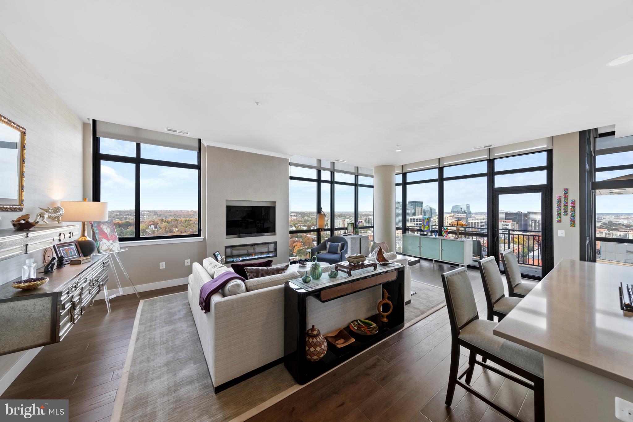 A once-in-a-lifetime opportunity to own the best views from any private residence in Arlington. The premier residence at 2000 Clarendon offers spectacular vistas with floor-to-ceiling windows showcasing unobstructed eastern and northern exposures that frame breathtaking views of the DC monuments to the east and the National Cathedral to the north. Enjoy majestic sunrises and sunsets daily, with sweeping cityscapes and sprawling treetop panoramas from every room. <BR><BR> A RARE AND EXCEPTIONAL CONDO. Built in 2020, this corner unit offers luxury in the clouds with 1,738 square feet, soaring 12-foot ceilings, and a private balcony. The layout features two bedrooms and a flexible den that can serve as a third bedroom. Imagine evenings relaxing with your customizable electric fireplace with city lights twinkling in the background. The owner has invested over $100,000 with a Designer to elevate the space, adding custom wall treatments, shelving, and lighting. The sale includes a large parking space conveniently located across from the elevators, with an additional space available for purchase, and the building’s largest storage unit. Condo fees are notably lower than other premier properties in the area, and include all utilities except electric. <BR><BR> EXCELLENT AMENITIES IN A NEW BUILDING. At 2000 Clarendon, residents enjoy an extensive amenity package, including a two-tier outdoor pool and terrace, a rooftop with panoramic views, a rooftop club room, a fitness center, a package room, and on-site management. As one of Arlington’s newest condo buildings—and with no new developments planned for the next 2-3 years—this is a rare opportunity for those seeking modern luxury in an unbeatable location. <BR><BR> A PREMIER LOCATION WITH 97 WALKSCORE. Easily walk to Whole Foods/Trader Joes, Metro, endless restaurants and bars, specialty fitness classes, shopping, and parks. Stroll across the Key Bridge to Georgetown, across the Memorial Bridge to the Washington Mall, or jog/bike the Mount Vernon Trail with scenic vistas of the Potomac and Washington Monument along the way. Minutes to Reagan National Airport and a short trip to Dulles International Airport, both accessible by Metro. Zip to downtown DC, Old Town Alexandria, Tysons, and more within minutes. There is currently one parking space owned by this unit, but a second parking space has been reserved for purchase through the builder for $45,000 and is optional to the buyer.