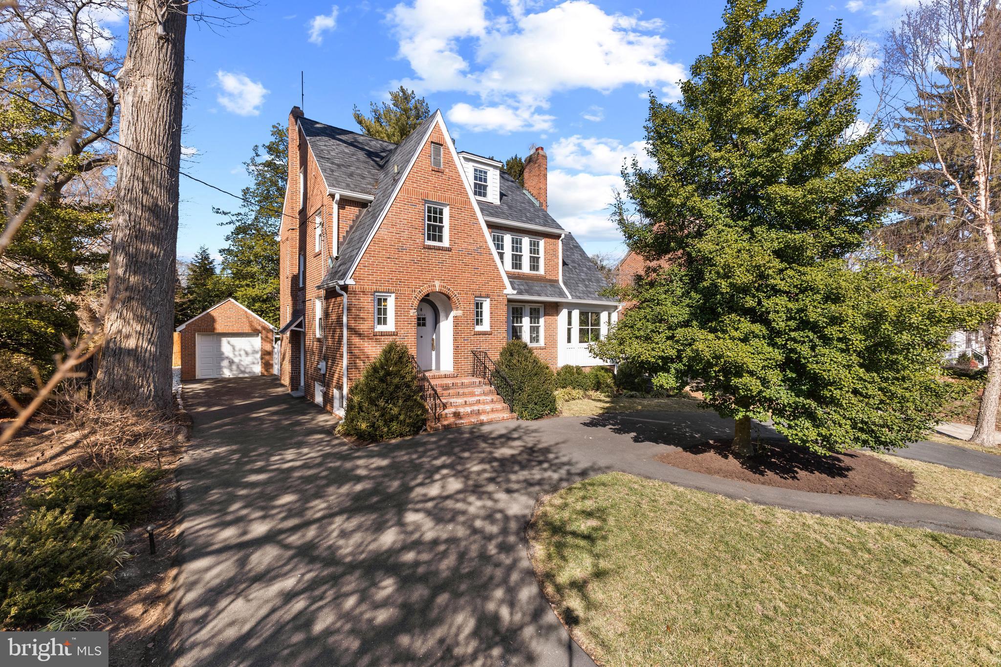 An elegant and charming Tudor in coveted Westover neighborhood sited on a large, private lot set back from the street. Step inside and enjoy  3,700 square feet of sun-filled living space over 4 levels. 5 bedrooms, 2 full and 2 half bathrooms and a versatile main floor. Arrive home and park in your circular driveway or pull back to the detached garage, walk into welcoming foyer with high ceilings and mudroom closet. Sunroom addition makes for the perfect home office and reading/playroom, walk out to your beautifully landscaped, fully fenced backyard which features a patio and mature trees. Beautiful hardwood floors throughout, huge walk-in closet in the primary bedroom, dedicated formal dining room and built-in butler’s pantry space. Since owning sellers have,  painted all exterior trim, replaced all windows, replaced the roof, installed central AC Unico system, resealed the driveway, updated hall, basement, and main level bathrooms, replaced all kitchen appliances, repainted deck off sunroom, repainted much of the interior, finished half of the basement. Stroll to Woodlawn Park or Lacey Woods, 1 block to The Custis Bike Trail. Walk to luxury Ballston Quarter, where the city's top restaurants, shopping, and studios reside. A short walk to Ballston Metro, one stop light to I-66 makes commuting into DC or west a breeze, less than 1 mile to Westover Village (The Italian Store, Westover Beer Garden, Lost Dog Café). Come get the best of both worlds, suburban life with the city at your fingertips.