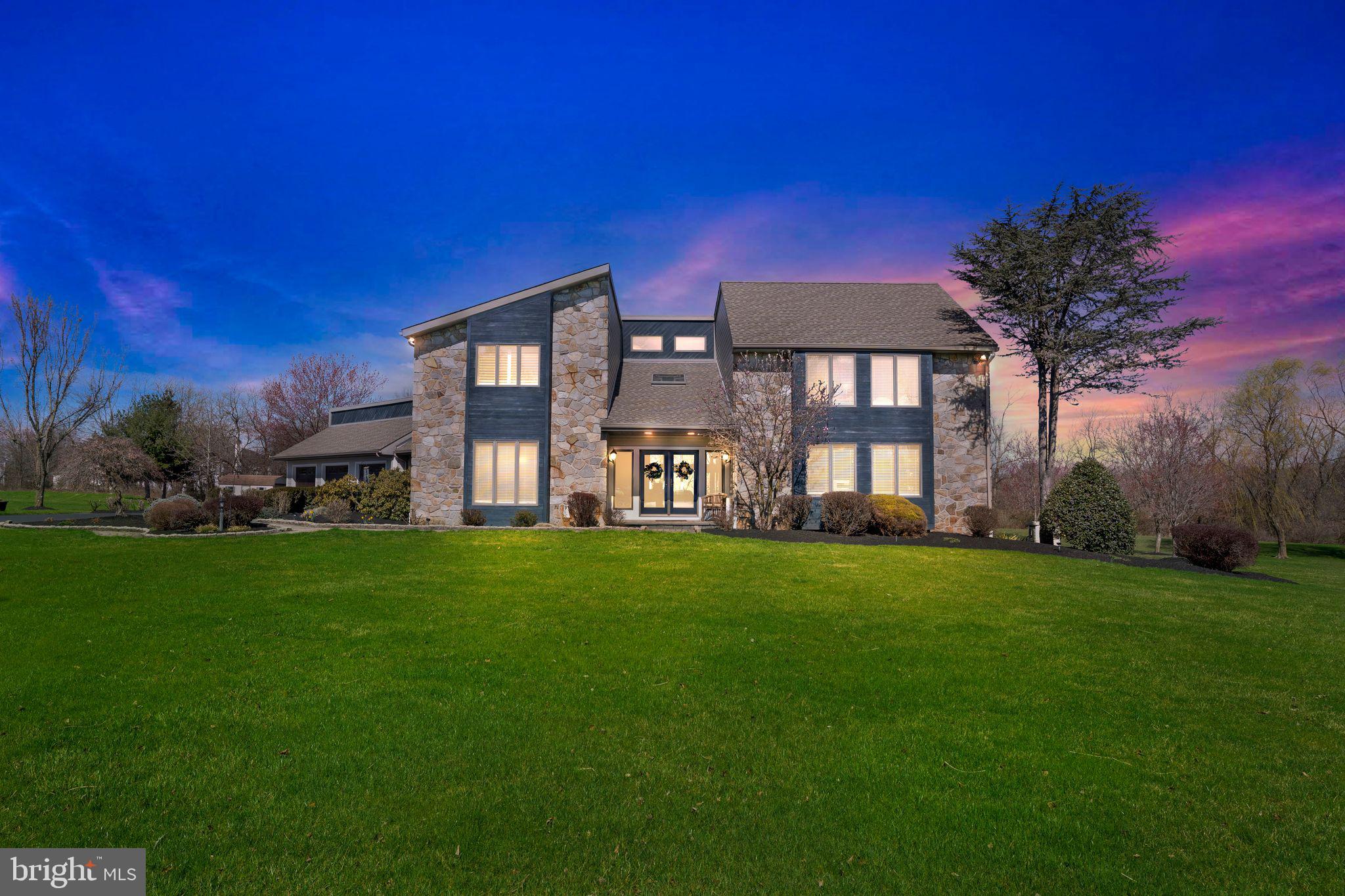 Nestled within the esteemed confines of Spring Ford School District, 22 Miller Circle in Royersford stands as a testament to refined living. This elegant custom-built home, set upon 2.7 acres of meticulously landscaped grounds, offers a harmonious blend of luxury and comfort. Located in Landis Woods Reserve on a private cul-de-sac, guests are greeted by the grandeur of double doors leading into a sanctuary of elegance and sophistication. Inside, hardwood floors guide the way through a series of exquisitely appointed areas. A formal living room or office exudes warmth, boasting a custom built-in wall unit and abundant natural light. The updated formal dining room with hardwood floors, recessed lighting and a decorator chandelier set the stage for hosting intimate gatherings or lavish dinners where cherished memories will be made. The gourmet kitchen, updated in 2019 has top-of-the-line appliances, center island, a wine cooler, and ceramic tile floors. The breakfast room, with its cathedral ceiling and skylight, beckons with views of the patio and private backyard setting. Unwind in the great room, where a propane fireplace with a stack stone hearth and wall takes center stage amidst floor-to-ceiling windows. The main level also features an oversized laundry room and a convenient half bath. Upstairs the primary bedroom awaits with his and her walk-in closets, a full wall closet with TV cabinet, a spa-like ensuite bathroom featuring a Jacuzzi whirlpool tub and walk-in shower. Three additional spacious bedrooms and a remodeled hall bath complete this floor. The lower level offers 1400 square feet of finished space, including a wet bar, gaming area, exercise room, and a powder room. Perfect for relaxation and recreation. Step outside to discover a beautifully landscaped backyard oasis, with an additional 3 season sunroom and brick paver patio ideal for all your entertainment needs. Additional features include a three-car garage, whole-house generator, water softener system, irrigation system, and Anderson Windows. Conveniently located near major routes and shopping. Don't miss the opportunity to make this rare find the place you call home - schedule your private tour today.
