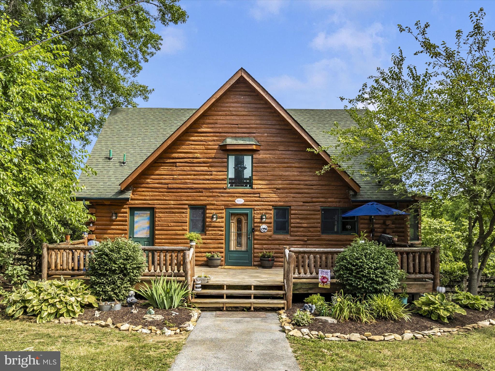 OFERS DUE BY 5pm 7/7. 


Charming Log Cabin Retreat Close to Frederick

Discover the perfect blend of seclusion and convenience in this adorable log cabin tucked away in a serene location. Nestled at the end of a private drive, this unique property offers the feeling of being in the middle of nowhere while being just minutes away from all that Frederick has to offer.

Exterior and Garage:

As you approach, you'll notice an expansive open field (not part of the property) that enhances the sense of privacy.
To the right, a spacious 4-bay garage with a loft above awaits, ideal for car enthusiasts, those in need of a large man cave, or space for all your toys.
A new roof has been installed on the smaller bay, ensuring the space is ready to impress. The wood siding requires some TLC, but the potential here is undeniable.
Log Cabin:

To the left, the charming log cabin greets you with its A-frame front and large deck, perfect for enjoying the tranquil surroundings.
Enter through the front door into the foyer, where an open log railing staircase leads to the cozy loft area.
A convenient half bath is located immediately to your left.
Main Level:

Down the hall, the master suite awaits, featuring a spacious layout, a walk-in closet, and a large master bath with a soaking tub and separate shower.
The living room boasts vaulted ceilings with exposed log beams, a gas fireplace for cozy winter nights, and dual sliding doors leading to the back deck.
The galley-style kitchen includes a bump-out for your kitchen table, providing a charming dining space.
The back deck, with its log railing and steps leading to the large, fully fenced backyard, is perfect for outdoor gatherings.
Loft Area:

The loft area, open to the main level below, is divided into two small rooms, ideal for a home office or guest quarters. While it currently serves as a bedroom, it lacks a closet to be officially designated as such.
Lower Level:

The lower level features a small bar area and family room, though new flooring will be needed.
This level also includes two large bedrooms and a full bath, with a walkout to the backyard.
Potential and Possibilities:

While some updating and maintenance are needed, this log cabin is brimming with possibilities and is sure to capture the hearts of many.
This home is priced to sell and won't last long. Don't miss your chance to own this charming retreat close to Frederick!