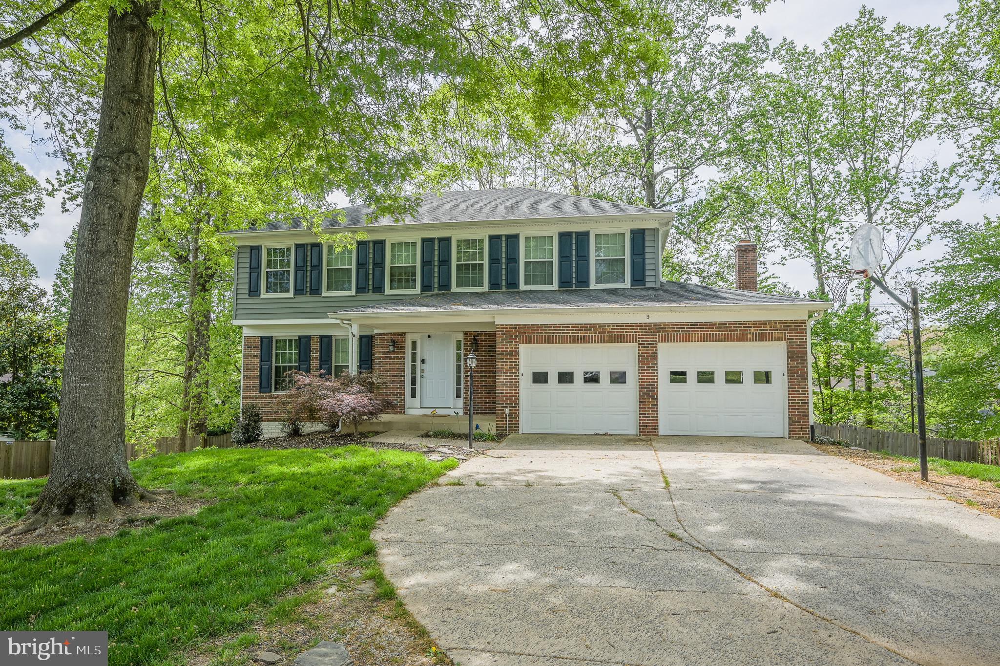 Welcome home to this stately,  updated property tucked away on a private cul-de-sac and located on a shared pipestem—offering rare privacy and added security.

Step onto the spacious front porch and into a freshly updated interior, featuring brand-new paint, flooring, and carpet to be completed before move-in. The main level opens with a welcoming foyer that flows into a formal living room with elegant French doors—perfect for a home office or playroom.

At the rear of the home, you'll find a large gourmet kitchen with granite countertops and stainless steel appliances, overlooking a generous family room with a cozy wood-burning fireplace. Also on the main floor is a stylishly updated powder room and access to the expansive rear deck and fully fenced backyard—ideal for relaxing or entertaining.

Upstairs, enjoy a massive primary suite with an attached bath and walk-in closet, along with three spacious additional bedrooms and a full hall bath. The fully finished basement provides even more living space, complete with built-in counters, multiple living areas, and two versatile bonus rooms—great for dens, offices, or guest space.