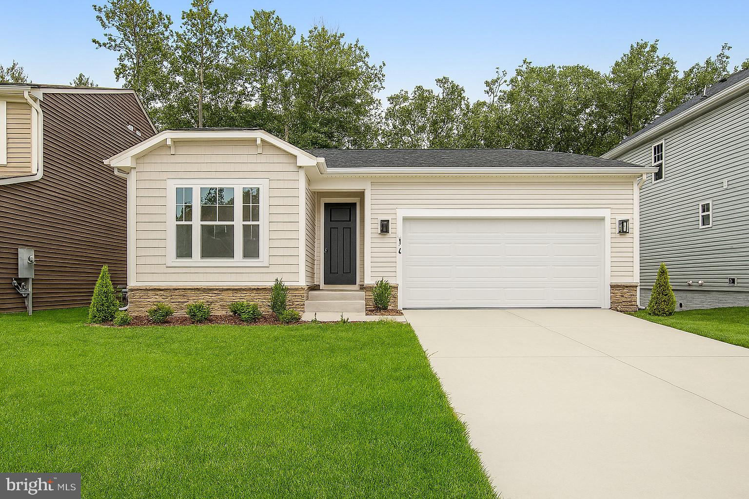 NEW Construction Only 2 remain  - Ready to move in today! Below Market financing available. This  ranch-style model home includes an inviting great room with fireplace and a well-designed kitchen with stainless-steel appliances, tile backsplash, hardwood flooring, a built-in pantry and an adjacent dining room. The luxurious primary suite offers a roomy walk-in closet and lavish bath with double sinks. You'll also appreciate the private study, extended covered deck and unfinished basement. Lot backs to trees!