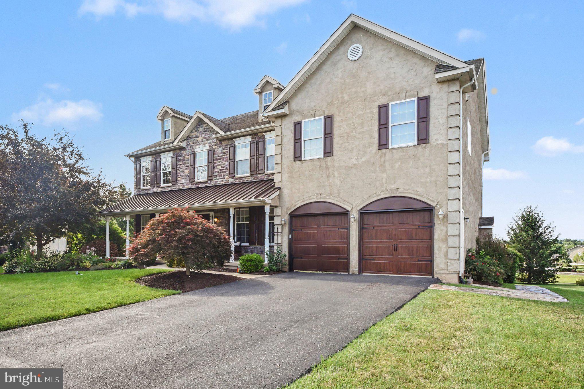 Welcome to 2202 Smithfield Ct, a beautifully maintained 4 bedroom, 3.5 bath  home tucked away on a quiet cul-de-sac in the sought after Biltmore Estates community of Harleysville. Built in 2008 and situated on a beautifully landscaped 0.43 acre lot, this impressive residence blends classic curb appeal with spacious, thoughtfully designed interiors that are perfect for everyday living and entertaining.

A charming covered front porch welcomes you inside to a dramatic two story foyer featuring rich hardwood flooring and an elegant staircase. Just off the entry, you'll find flexible living spaces ideal for a home office, study, formal living room, or playroom. The heart of the home showcases an open concept design where the expansive family room impresses with asoaring ceilings, oversized windows that flood the space with natural light, and a stunning floor to ceiling stone fireplace that creates a warm and inviting focal point.

The spacious kitchen is designed for both function and style, featuring abundant cabinetry, granite countertops, stainless steel appliances, a large center island with seating, decorative tile backsplash, double wall ovens, gas cooking, built in wine storage, beverage refrigerator, and a dedicated coffee bar. The adjoining dining area provides seamless access to a sunlit sitting area and the outdoor deck, creating the perfect setting for indoor and outdoor entertaining.

Upstairs, the luxurious primary suite offers a peaceful retreat with a spacious sitting area, tray ceiling, oversized walk in closet, and an expansive ensuite bath complete with dual vanities, a soaking tub, and separate shower. Three additional generously sized bedrooms provide excellent closet space and flexibility for family, guests, or work from home needs.

The finished basement significantly expands the home's living space with a large recreation room perfect for movie nights, games, fitness, or hobbies, while additional unfinished storage space offers plenty of room for seasonal items and organization.

Outdoor living is equally inviting with a spacious rear deck overlooking the private backyard, providing an ideal space for relaxing, dining, or hosting gatherings. Additional highlights include a two car garage with inside access and automatic garage door openers, plus a freshly paved driveway offering ample parking.

Located within the highly regarded Perkiomen Valley School District and just minutes from the quaint town of Skippack where you can enjoy shopping and dining and Evenasburg State park where you can enjoy hiking, fishing and horse back riding, this exceptional  home  offers the perfect combination of comfort, space, and location.