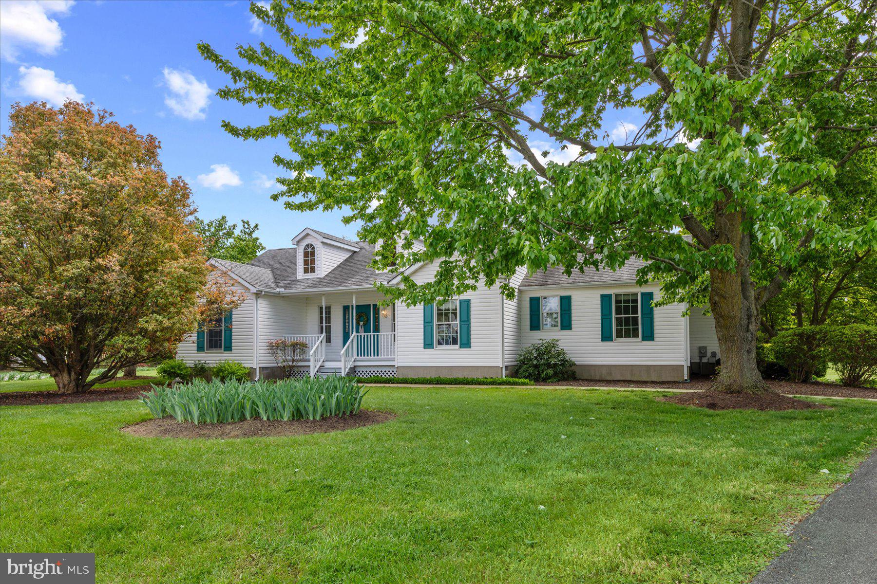 Immaculate 3-bedroom, 2-bath home set on a breathtaking, oversized lot with exquisite mature landscaping and a truly picturesque setting. Surrounded by lush greenery and stunning trees, including a graceful willow, this property offers a serene, park-like atmosphere, with views from nearly every window resembling beautiful landscape artwork. Inside, the home features a bright, open floor plan designed for modern living. A spacious family room flows seamlessly into the generous kitchen, while a separate dining room remains open to the main living areas—perfect for everyday living and entertaining. The kitchen is highlighted by beautiful French doors leading to the back patio, offering easy access for cooking, grilling, and hosting—perfect for summer barbecues and outdoor entertaining. Palladium windows throughout enhance the home with natural light and showcase the spectacular views. The thoughtfully designed layout offers a private primary suite on one side of the home with its own attached bath. Just off the kitchen and near the primary bedroom is a separate laundry room for added convenience. Two additional bedrooms are situated on the opposite side and share a well-appointed full hall bath. Additional features include fresh paint throughout, a side-entry one-car garage, and an extra-large driveway providing ample off-street parking. Tucked away on a quiet cul-de-sac with no through traffic, this home offers a rare combination of privacy, beauty, and tranquility.