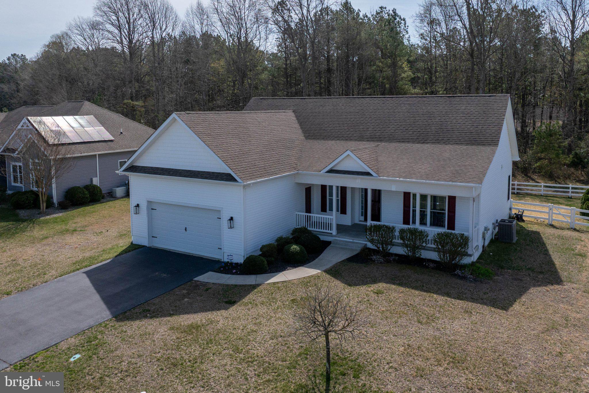 This inviting and well maintained 3-bedroom, 2-bath home, built in 2013,  is located in the desirable Ridings at Rehoboth community, offering a quiet setting with convenient access to the beaches and coastal amenities. The thoughtfully designed split-bedroom layout provides  privacy for the primary suite and guest bedrooms, creating a comfortable and functional floor plan.  The spacious kitchen has plenty of cabinets and countertop space for all of your appliances and lots of space for preparing delicious meals. 

A partially finished basement includes a walk-out on the side of the house, it has plumbing for future bathroom, kitchen or bar and adds flexible space that can be used for a recreation room, home office, or additional storage. The sliding door in front of the kitchen leads you to the paver patio and fully fenced backyard—ideal for relaxing, entertaining, or pets, with tons of space for an in ground pool , vegetable garden and planting your favorite flowers.  

Residents of Ridings at Rehoboth enjoy spacious homesites, community open space, and amenities such as a pool, clubhouse, and fitness room, all within minutes of Lewes and Rehoboth’s shopping, restaurants, and shoreline.  The seller is offering a $5,000 credit toward any upgrades or additions to the property. This credit can be used for various improvements, including the installation of a door for direct access from the kitchen to the garage.