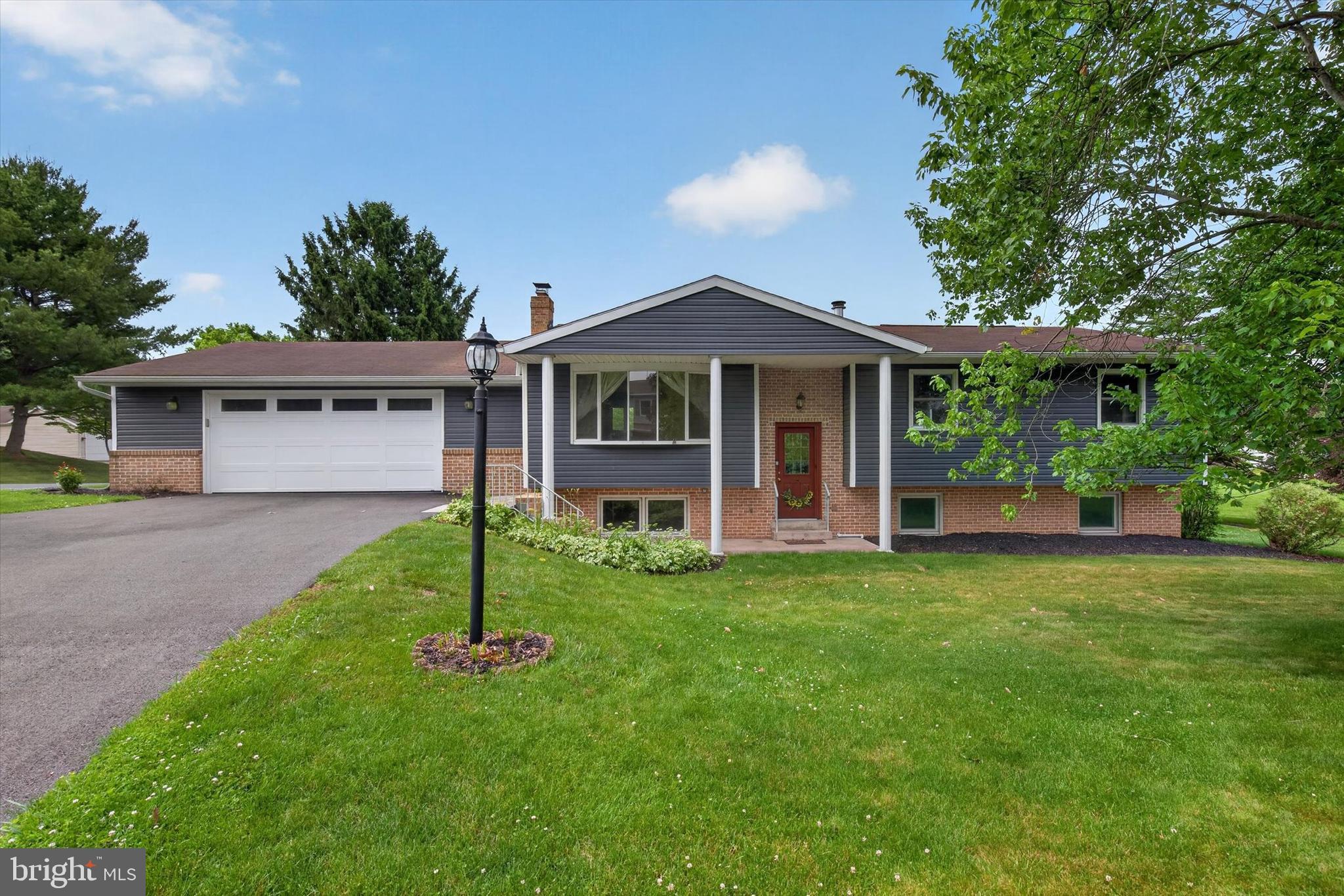 Welcome home to this spacious 4-bedroom, 2.5-bath bi-level offering over 2,500 square feet of comfortable living space in a quiet Mechanicsburg neighborhood. Hardwood floors flow throughout the main living areas, including the living room, dining area, and kitchen, creating a warm and inviting atmosphere.
The main level features three bedrooms, including the primary bedroom with convenient deck access and an attached half bath. Downstairs, the inviting family room centers around a cozy wood-burning fireplace and flows seamlessly into the adjoining bar area, creating an ideal space for entertaining, game days, or movie nights. A fourth bedroom, full bath, and laundry area complete the lower level.
Enjoy your morning coffee in the bright three-season room overlooking the private backyard, or step outside to the expansive deck. Below, a covered patio provides an additional outdoor living space ideal for enjoying the peaceful setting. Situated on a desirable corner lot with a private, level yard, this property offers the perfect combination of indoor and outdoor living.
Located within the highly sought after Mechanicsburg Area School District, this home offers convenient access to Route 15, Pennsylvania Turnpike, shopping, dining, and everyday amenities.