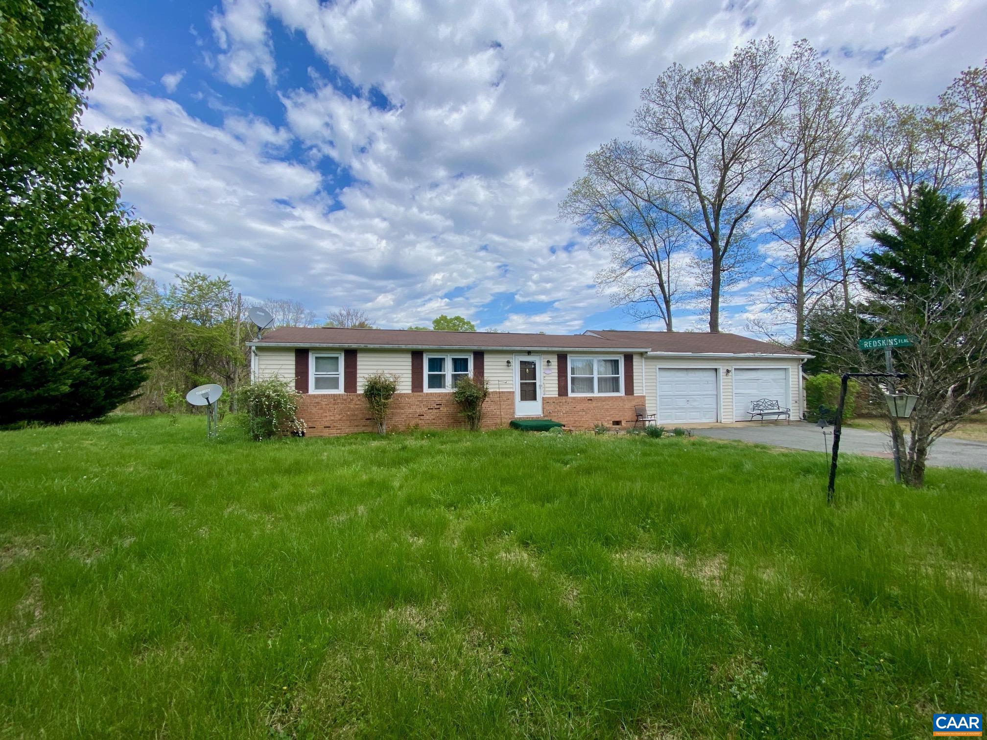 Welcome to this ranch home set on 1.5 acres in beautiful Gordonsville. Offering 3 bedrooms and 1.5 baths, with living room, family room and home office, this property provides one-level living along with an attached 2-car garage. A rear deck overlooks the semi-private backyard?an ideal spot for grilling out and enjoying the peaceful surroundings. Mature evergreen trees line the front of the property, creating a natural buffer from the road and enhancing the sense of privacy. This property presents a great opportunity to personalize and make it your own while enjoying a desirable setting. Located just minutes from local shops, dining, and major routes, Gordonsville offers small-town charm, historic appeal, and convenient access to Charlottesville. Enjoy nearby wineries, scenic countryside, and outdoor recreation. Stay connected with Fiber internet provided by FiberLync!