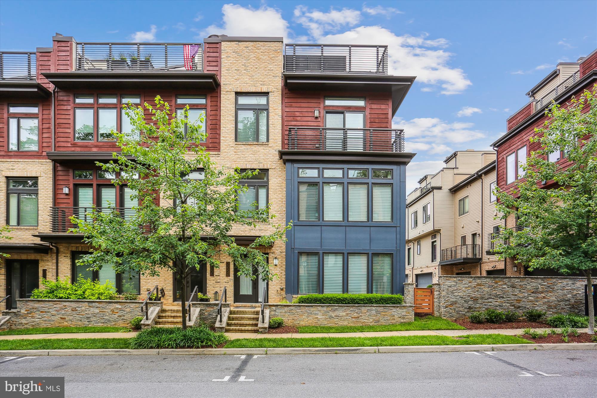 ACCEPTING BACK UP OFFERS. This beautiful, spacious (approx. 3400+ sq ft), end unit elevator townhouse is the epitome of luxury in desirable Grosvenor Heights, built by award-winning EYA Homes. The Cameron floor plan  is the largest of any in the community, and this particular TH served as the builder’s showcase model.  Loaded with all the available builder upgrades, there are so many extras, from the entry level with its 4th ensuite bedroom/flex space to the rooftop terrace.  Elegant,  contemporary iron railing banisters, top line quartz countertops, and exceptional  custom kitchen cabinetry are just a few of the extensive upgrades. The huge wrap-around rooftop is completely equipped with kitchen work and prep space, dishwasher, mini fridge, built-in gas grill, retractable awning, gas fireplace and wood floor tiling, providing an  almost year-round entertaining and relaxation space. Originally designed with the Savant smart system for sound, TV, lights and blinds, control is always at your fingertips! An open floor plan, walls of windows and 10' foot ceilings add to the dramatic light-filled space. Located near 495 and 270 makes commuting and travel a breeze. And being less than a mile from Grosvenor metro, Bethesda Trolley Trail, Fleming Park and Wildwood Shopping Center, means you can easily walk, bike (or drive) to all the nearby amenities.