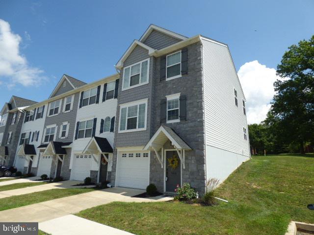 A few years old, but shows like new... and priced below new! French Country Style 3BR, 2.5BA end-unit in Carriage Crossings, Dallastown Schools. Lots of windows for natural light! Beautiful eat-in kitchen with island, walk-in pantry, laundry, and patio access. Master with full bath and walk-in closet. Future family rm in lower level. Patio and finished garage.