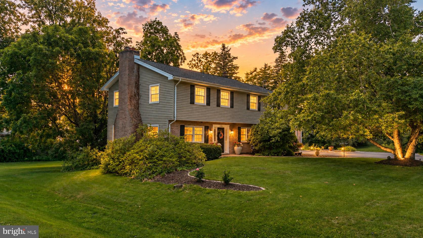 Welcome to this classic and beautifully maintained 4-bedroom, 3.5-bath home located in the highly desirable Kaywood Development in Boalsburg. Offering generous living spaces and timeless charm, this home is designed for comfortable everyday living and effortless entertaining. The main level features an oversized living room highlighted by a cozy wood-burning fireplace, creating the perfect gathering space for family and friends. The spacious eat-in kitchen offers abundant cabinet storage and workspace, while the adjacent den provides a relaxing retreat for reading, watching television, or simply unwinding. A separate formal dining room is ideal for hosting holiday meals and special occasions. Hardwood flooring flows throughout the main level, and a convenient powder room completes the first floor. Step outside from the kitchen onto the expansive deck overlooking the beautifully landscaped and meticulously maintained backyard—an ideal setting for outdoor dining, entertaining, or enjoying peaceful evenings. Upstairs, you'll find four spacious bedrooms, including a large owner's suite featuring an expansive walk-in closet and a beautifully updated private bath with double vanity and tiled walk-in shower. Three additional bedrooms, which include a second ensuite and a third separate full bath provide ample space for family members or guests. The walkout lower level offers even more living space with a finished family room featuring a second wood-burning fireplace, a separate office or hobby room, and access to a large screened porch with additional storage space. Additional highlights include oil hot water heat, central air conditioning, mature landscaping, and a sought-after location close to schools, parks, shopping, and all that historic Boalsburg offers. Don't miss this opportunity to own a spacious, well-cared-for home in one of Boalsburg's most established neighborhoods. Some pictures are virtually staged.