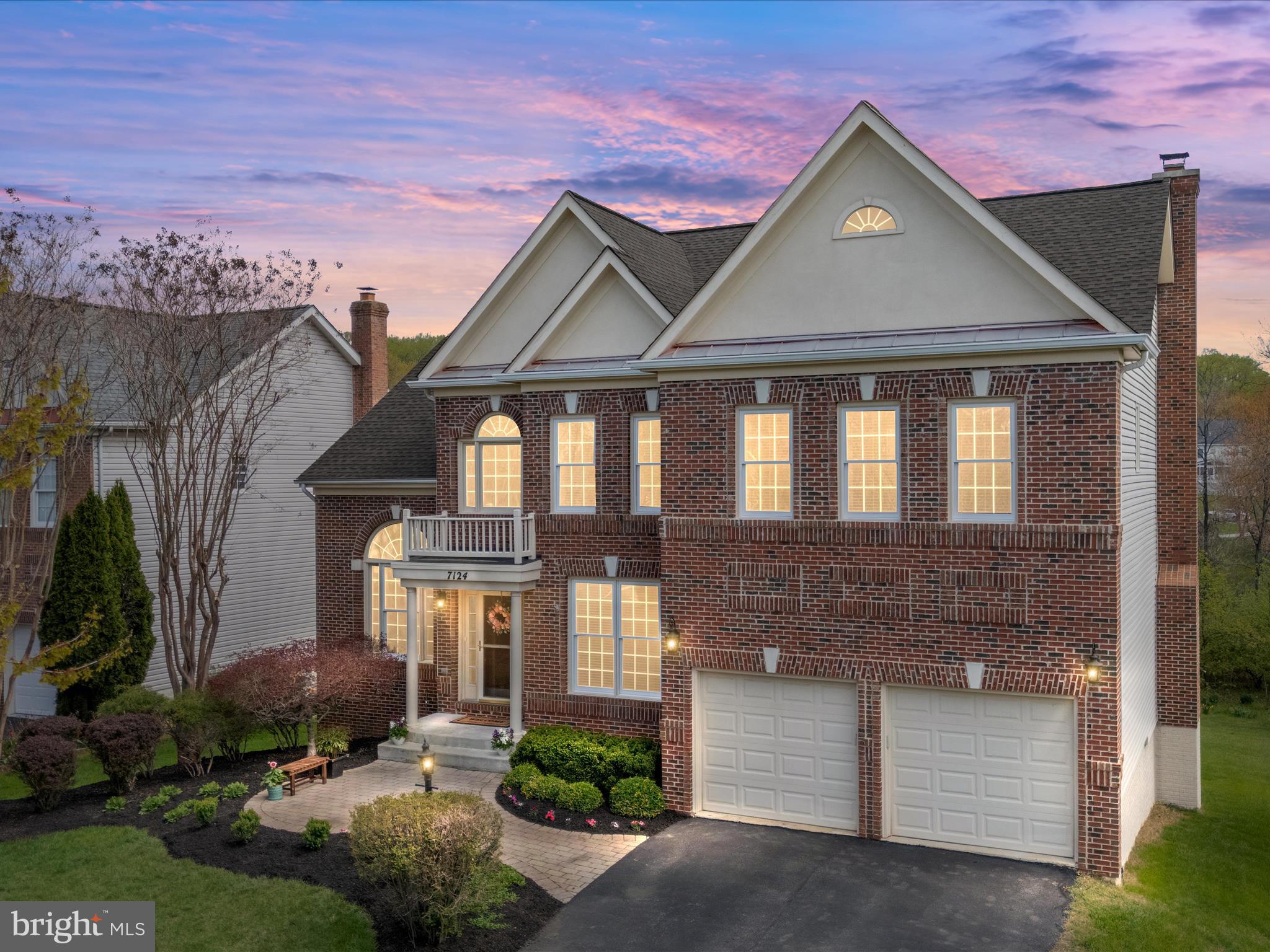 Stunning brick-front colonial featuring timeless design and expert craftsmanship nestled on a quiet cul-de-sac in the highly sought-after Grovemont neighborhood!  From the moment you step inside, you feel the warmth and welcoming ambiance of this beautiful home.  The two story foyer is bathed in natural light. Wide plank hickory engineered wood flooring and on-trend neutral paint set the tone for this special home. The heart of the home is the fully renovated chef's kitchen featuring custom white cabinetry with soft close doors & drawers, an expansive 9' island designed for gathering and entertaining, quartz countertops, a porcelain farmhouse sink, stainless steel appliances including a gas cooktop, double oven with convection, custom backsplash, upgraded lighting, and a dedicated beverage nook with mini-fridge — truly an entertainer's dream!  Relax in the sunken family room featuring upgraded plush carpet and a wood burning fireplace with custom trim, shiplap, and mantle. An elegant chandelier and decorative molding accentuate the formal dining room while the 12' tall expansive living room showcases a grandeur Palladian window and a radiant sun-drenched glow. The main level home office is perfect for work from home and features impressive custom built-in soft close cabinetry, white Carrara marble countertops, and a shiplap accent wall. The upper level features four generously sized bedrooms, two upgraded baths and an option for upper level laundry. The double-door entry primary retreat offers upgraded carpet, a tray ceiling, two walk-in closets, and a spa-like primary bath with upgraded cabinetry, flooring, quartz countertops, upgraded fixtures, a soaking tub, and a frameless shower. The finished walk-out lower level features a private 5th bedroom, a full bath, and a spacious living area, perfect for playing a game or binging your favorite shows. Relax on the low-maintenance deck overlooking a spacious flat back yard backing to open space and wooded preserve — perfect for gatherings and privacy! This home is located just steps to the natural beauty of Patapsco State Park and Rockburn Branch Park and provides great access to commuter routes. Recent mechanical updates include upper level HVAC in 2024, roof in 2017, main HVAC in 2017 and water heater in 2017.  Don't miss your opportunity to let your memories flourish in this timeless gem of a home!