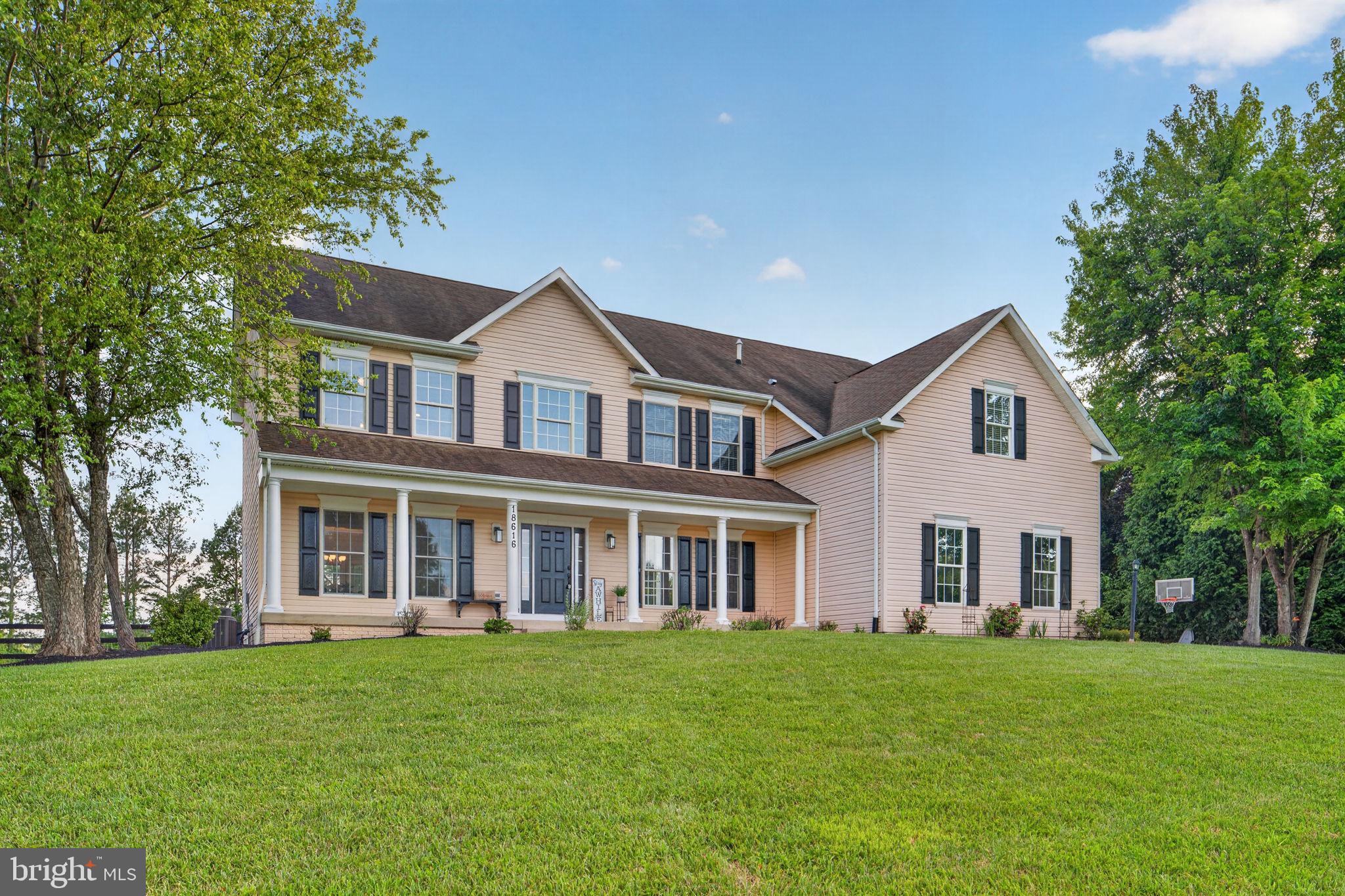 Perched against the backdrop of the Blue Ridge, this beautifully updated Bluemont home pairs breathtaking mountain views with modern comfort on a truly special property. With 5 bedrooms, 4.5 baths, and a bright, open layout designed for both everyday living and entertaining, every space feels warm, welcoming, and thoughtfully updated.
Inside, rich hardwood floors and oversized windows fill the home with natural light and frame the surrounding views. The renovated kitchen is the centerpiece of the main level, featuring white cabinetry, quartz countertops, designer backsplash, stainless steel appliances, double wall ovens, recessed lighting, a large center island and an oversized walk-in pantry. Just beyond, the spacious great room with fireplace opens into the four-season sunroom—an inviting spot to enjoy morning coffee or unwind while taking in the peaceful setting year-round. Updated lighting and paint refresh makes this move in ready! 
The primary suite offers a relaxing retreat with high ceilings, generous walk-in closets, and a beautifully renovated spa-inspired bath complete with a soaking tub and frameless glass shower. Additional bedrooms and baths are equally well appointed, offering plenty of room for family and guests. On this upper level you have a huge laundry room with cabinets and window to let in natural light. Benefit from solar panels installed recently- huge savings on electric bills and no lease or transferring loan. 
Freshly updated with new flooring and paint, the finished walk-out lower level offers exceptional versatility and comfort. This inviting space features recessed lighting,  kitchenette, additional laundry, a private bedroom, and a full bath—perfect for guests, extended stays, or an au pair/in-law suite. With flexible living spaces and thoughtful conveniences throughout, this home is beautifully suited for multi-generational living. 
Outside, enjoy two separately fenced acres perfect for animals with a mini barn and chicken coop! Just bring the animals.  The main backyard has  playground and sunken trampoline and kids club house. Recent updates include the sunroom addition (2020), kitchen renovation (2019), walk-in pantry (2019), primary bath renovation (2019), HVAC (2019), fully fenced yard (2017), new septic system (2017), 11.4 kW solar panel installation (2022), refreshed walk-out lower level with updated flooring and finishes (2026), reinforced fencing (2022), HVAC/AC improvements (2025), Starlink satellite internet and backup generator adds peace of mind and convenience.
A rare Bluemont offering with unforgettable views, thoughtful upgrades, and space to truly enjoy Virginia country living.