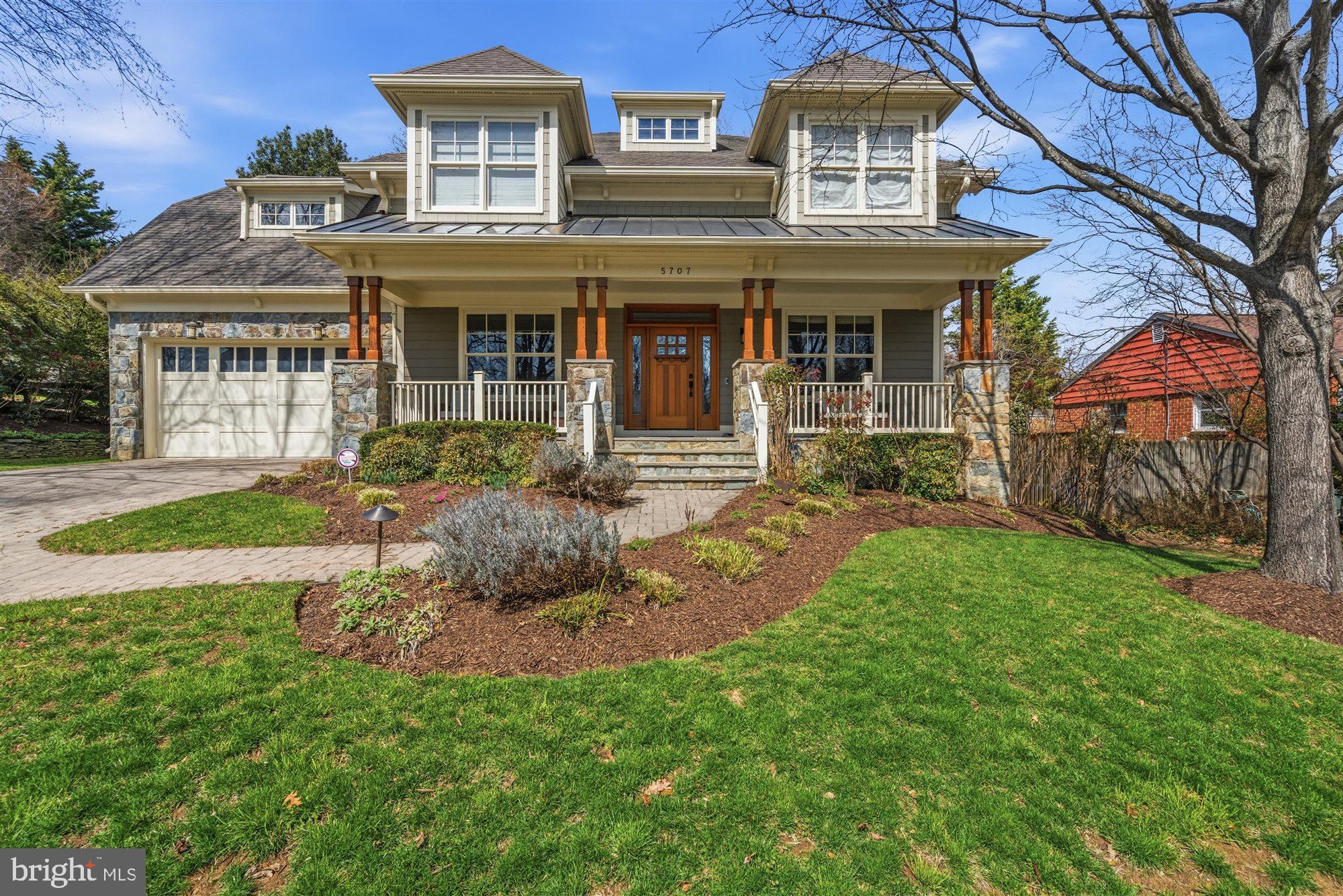 Welcome to your dream home! This meticulously crafted Craftsman-style residence, built by esteemed Luxury builder Great Jones Build, is nestled on a spacious level lot in the highly desirable Discovery Elementary, Williamsburg Middle, and Yorktown High School pyramid.
From the moment you arrive, you'll be captivated by the exquisite curb appeal featuring a large front porch with a striking metal roof, elegant stone accents, and rich cedar columns that frame the inviting mahogany front door. Dormer windows and charming carriage-style garage doors add to the home's character, while the professional landscaping creates a welcoming ambiance.

Step inside to discover an interior that exudes luxury and comfort. The gourmet kitchen is a chef's dream, equipped with a Subzero refrigerator, Wolf range, and Thermador oven, complemented by a large Silestone island and granite countertops. The bright breakfast room overlooks a large backyard, offering the perfect setting for gatherings and summer BBQs. As you come in from the garage there is a spacious drop zone that includes a mudroom, laundry room and pantry that adds practicality to everyday life.

The spacious great room features coffered ceilings, a cozy stone-surround fireplace, and ample natural light. The main level features a formal dining room, perfect for entertaining, as well as a beautifully appointed library complete with built-in shelves and doors for added privacy. Enjoy the whole home media system powered by Control4.

This home boasts five generously sized bedrooms, including a bonus room on the bedroom level that is perfect for an office, flex space, or an additional bedroom. With 4.5 bathrooms, everyone will enjoy their own space and privacy.

Venture downstairs to your very own theater room for movie nights or simply unwind in the fully finished basement, which also includes another bedroom and bathroom, along with a walk-out access to the stunning backyard.

Don’t miss out on this rare opportunity to own a beautifully designed home that combines luxury living with a fantastic location. **OFFERS, IF ANY, DUE MONDAY 4/13/26 AT NOON**