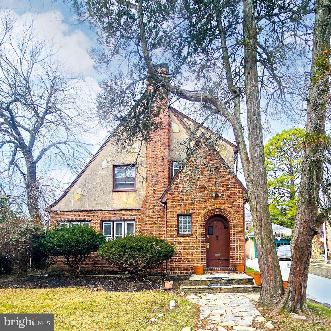 Back on the Market and Appraised Above List Price (Original buyer unable to proceed with purchase.) Waiting for you to make it your own, 3502 Wabash is perfectly priced for you to personalize while still retaining equity in a historic neighborhood! 

Step into this beautiful English Cottage style historic home, where timeless character meets comfortable living. Nestled on a tree-lined street, this charming residence sits gracefully back from the road, offering both privacy and curb appeal. Its original slate roof and stone-edged front yard set the stage for a home filled with warmth and authenticity. Inside, the entryway welcomes you with a stunning original staircase featuring curved baluster and beautiful parquet floors. The spacious living room is a sizable retreat with an original fireplace surround, and several arched doorways, while the adjacent sitting room provides an inviting and cozy nook for reading or relaxation. The large dining room, with its beautiful inlaid wood floor, is perfect for gatherings and features historic windows. With it's own antique window and original storm door, the kitchen blends modern convenience with classic charm,  featuring stainless steel appliances and modern cabinetry. Just off of the kitchen is added space with endless potential as a pantry or breakfast room.  A lovely stone-edged porch invites you to enjoy morning coffee or evening breezes in privacy. The first floor also includes a powder room and a generously sized coat closet for added convenience, as well as a nostalgic telephone nook that showcases the historical appeal of the interior.

Throughout the home, inlaid wood floors, deep baseboards, and beautifully crafted radiator covers showcase its historic character. Abundant windows bathe the home in natural light, enhancing its warm and inviting atmosphere. Solid wood doors throughout the home feature their original hardware, another aspect of this residence that begs to be adored. 

Upstairs, three spacious bedrooms reflect the home’s original charm, while the full bathroom boasts vintage details, including an original built-in linen closet. 

The finished basement is accented with beautiful stone walls and includes a laundry room, a full bathroom and second fireplace. The main area of the basement is a space perfect for recreation, relaxation or entertaining. Additionally, there is an extra room in the basement that could easily serve as a 4th bedroom or home office. The house has a convenient side entrance to access the main floor or the basement area. 
Outside, a separate two-car garage complements the property, adding both functionality and charm. 
This remarkable home, listed in a historic community, is a rare find—offering a perfect blend of preserved elegance and modern comfort in a truly special setting.