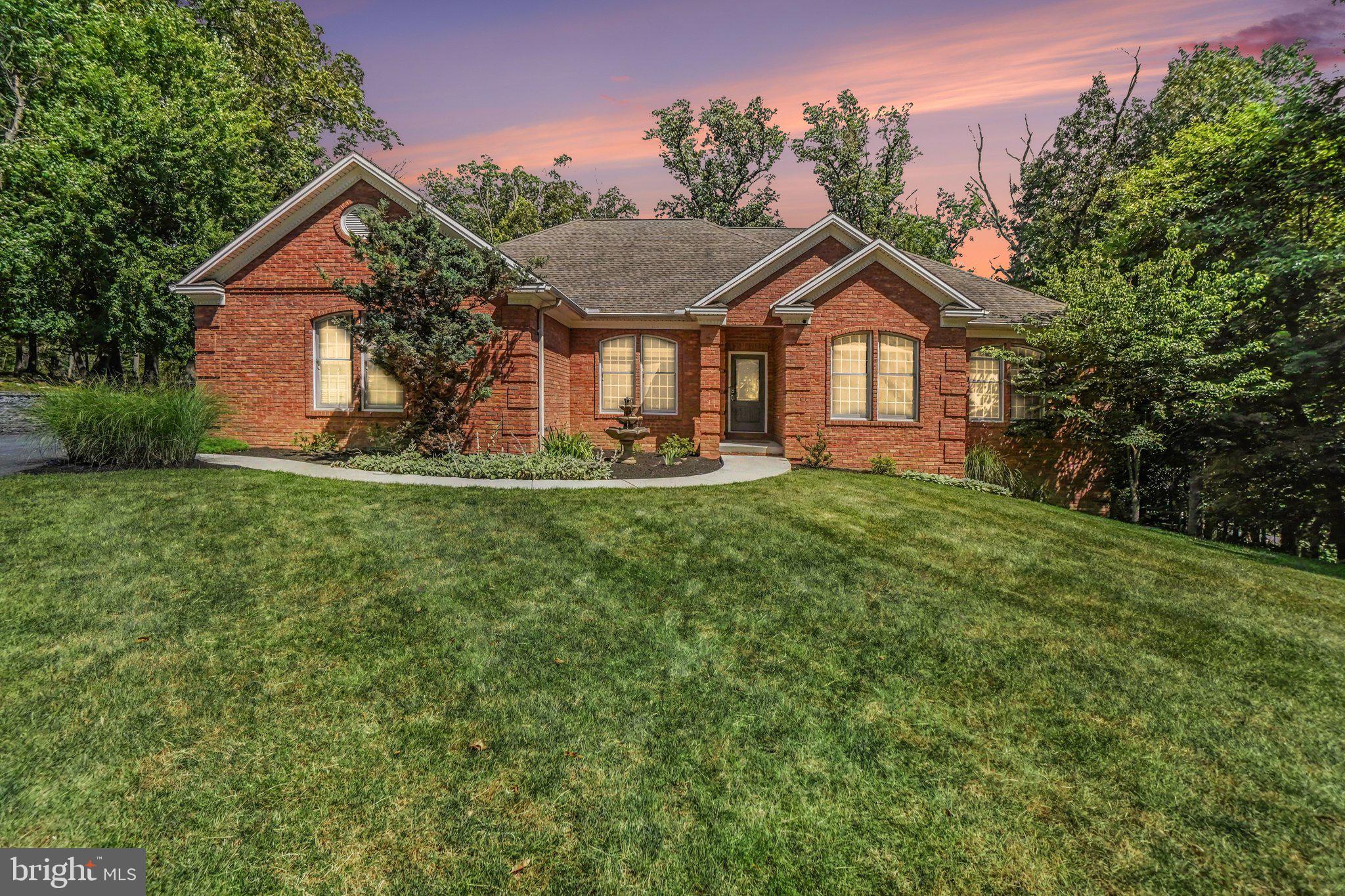 Beautifully updated ranch home offering 4 bedrooms and 3 full baths.  The gourmet kitchen features granite countertops, a center island, ceramic tile flooring and ample space for cooking and entertaining.  The main floor showcases all new walnut hardwood flooring throughout the living room, 3 bedrooms, and closets along with custom built-ins, elegant crown molding and a stunning 48 inch gas fireplace with a granite mantel.  The atrium/sunroom features new carpeting and provides a bright, inviting space to relax.

The finished walkout basement expands the living area with luxery vinyl plank flooring, a large King bedroom suite with live edge barn doors and a full bath with walk-in shower.  A second kitchen with an impressive L-Shaped live edge bar and a natural gas fireplace with a custom live-edge mantel is perfect for entertaining or multi-generational living.

Step outside through the French doors to the  new composite deck overlooking the fenced backyard, providing the ideal setting for outdoor gatherings and everyday enjoyment.  This move in ready home combines quality craftmanship, thoughtful updates, and exceptional living space both inside and out!