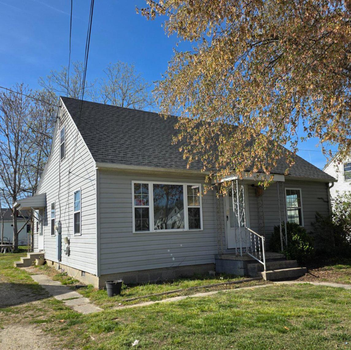 Located just west of Route 113 and right off of Route 50 in Pocomoke City, this 1.5 story home offers a flexible layout in an established residential area close to shopping, dining and other amenities. The main level features a living room, kitchen, dining area, laundry space, one full bathroom as well as one stand alone bedroom and two adjoining bedrooms. Upstairs is a bonus space with two adjoining rooms that could serve as an additional bedroom, office space or storage. There is hardwood flooring throughout most of the home and vinyl flooring in the kitchen. The kitchen and bathroom are in need of updating/cosmetic repair. The interior has been freshly painted, the landscaping refreshed, and a new roof was installed in 2025. Overall, the property is in good condition and offers a solid opportunity for first time home buyers or investors looking for a value-add property with room for updates and personalization. Property is being sold as-is.