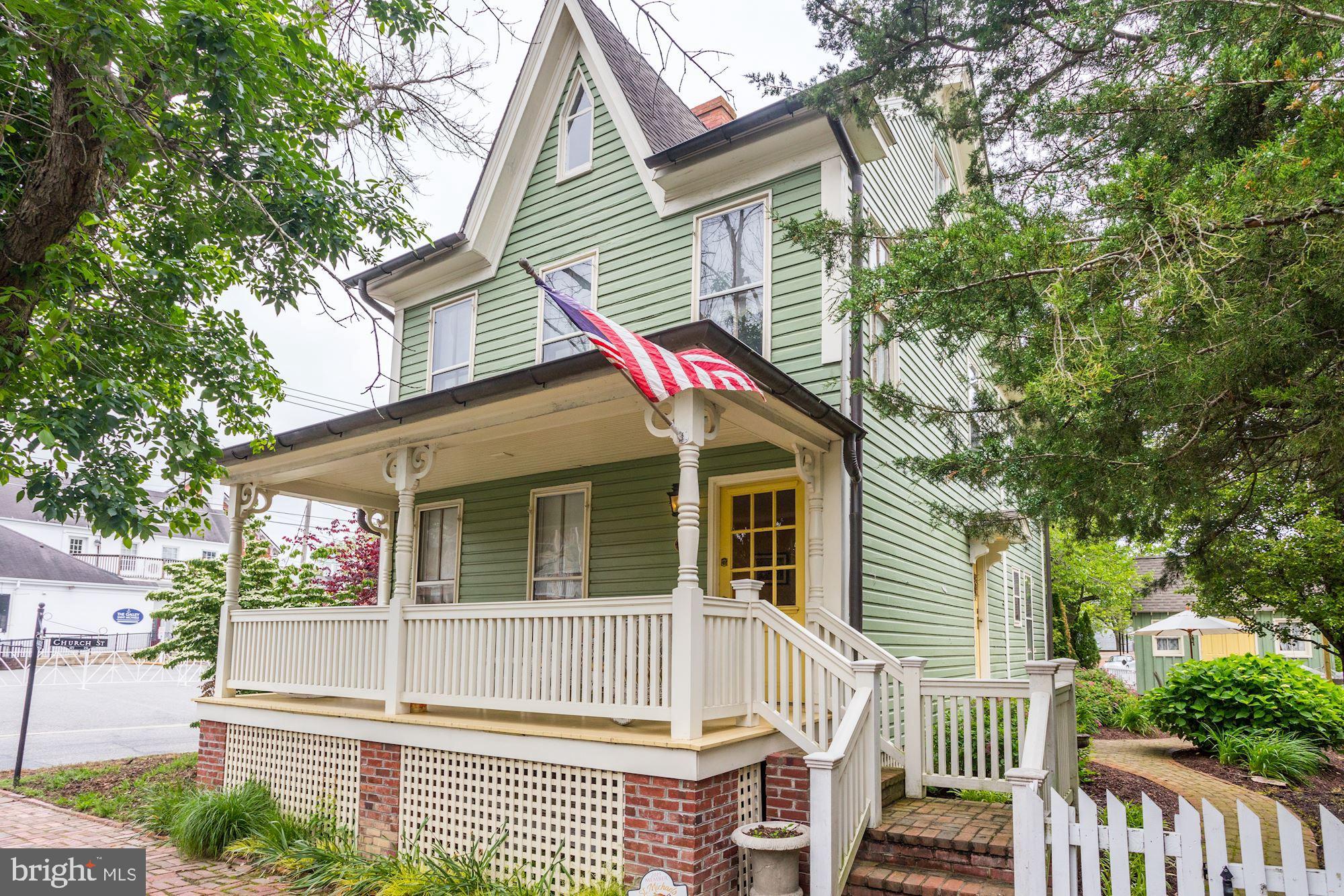 Beautifully restored Historic Victorian in the heart of Saint Michaels. This charming home has a strong rental history, last tenant was paying $4,500 a month. From the wide, welcoming front porch to the gated, manicured yard—complete with a hammock ideal for long afternoon naps—every space is designed for comfort and relaxation. A brick walkway leads to the custom beveled‑glass entry door and into the warm, inviting family room.

Inside, the home features rich pine floors throughout, a cherry kitchen with stainless steel appliances, granite countertops, and an open flow into the charming dining room. The spacious family room includes a propane stove for cozy winter days. The first floor also offers a full laundry room and an ornate powder room.

The original staircase leads to the second floor, which includes three bedrooms and a renovated marble‑tile full bath. The private third‑floor primary suite offers a peaceful retreat with its own en‑suite bath.

Just one block from the water—with water views from the street—this home captures the best of small‑town living. Enjoy walking access to Saint Michaels’ restaurants, quaint shops, kayaking, swimming, boating, and biking. It’s a special property ready for unforgettable memories with family and friends. Whether you're looking for a proven investment property or a beautiful home for your family, this one stands out.