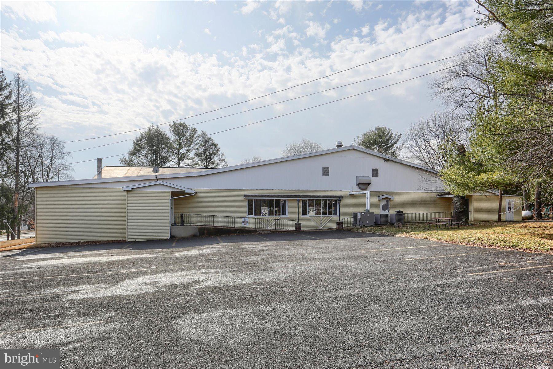 Mixed-Use Investment Opportunity – Pine View Acres
Mixed-use commercial property offering multiple potential income streams on approximately 2.2 acres. The property includes a large commercial building with approximately 14,000+ square feet currently configured for restaurant, bar, and event use, along with additional residential rental units across multiple structures.
The commercial space features indoor dining and bar areas, a stage and dance floor, and a lower-level bar with additional seating. Outdoor amenities include a pavilion and swimming pool, providing flexible space for dining service, private events, and gatherings.
Residential improvements include a single-family home, duplex, and triplex totaling six rental units, offering additional income potential.
A large private parking lot provides approximately 100+ parking spaces. The sale includes a substantial amount of existing restaurant equipment, with inventory list available.
Liquor license and operational permits are currently active. The liquor license is available and will transfer through a separate transaction in accordance with Pennsylvania liquor license transfer requirements.
Property is being sold as-is. Buyer is responsible for verifying zoning, permitted uses, property details, and municipal approvals.
