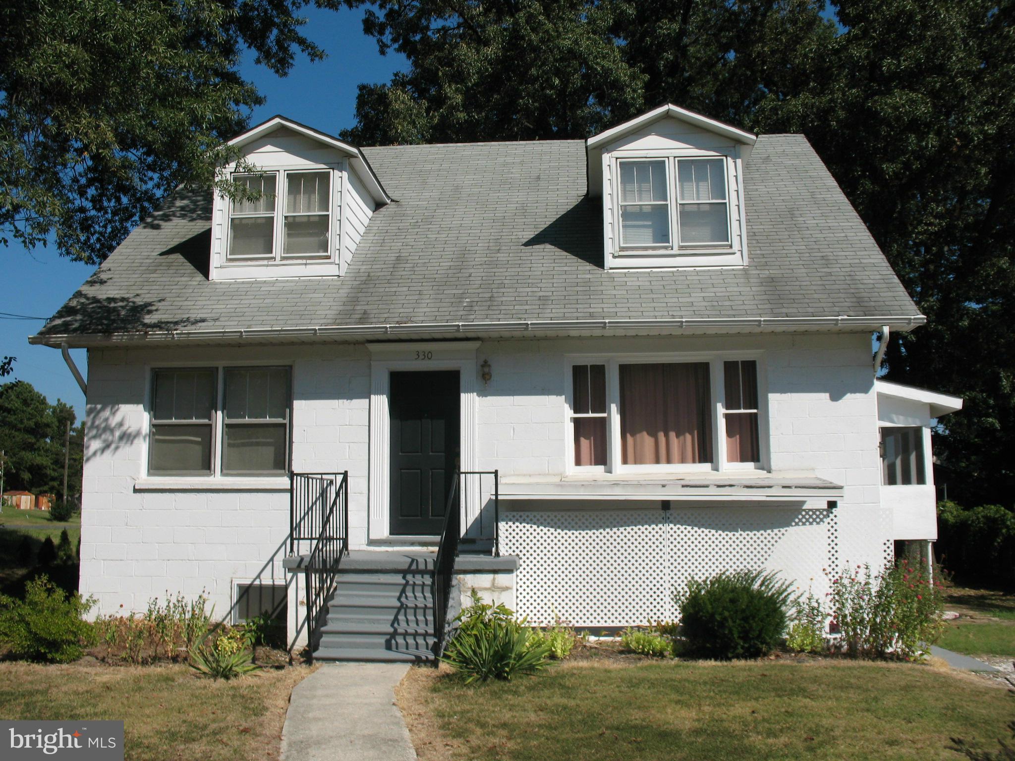 PROPERTY IS WINTERIZED. UNABLE TO USE TOILETS. Possibilities! Live on main floor& rent upper. (separate entrances).  Bright, Airy Home set back on 1/2 acre, corner lot. HVAC w/new duct work. Upgraded Electrical! Beautiful hardwood floors under carpets, updated kitchen, screened porch, gutter helmets. No HOA, Prime Location -near BW Medical Center, County Gov't & Major Routes- 695,97,100.