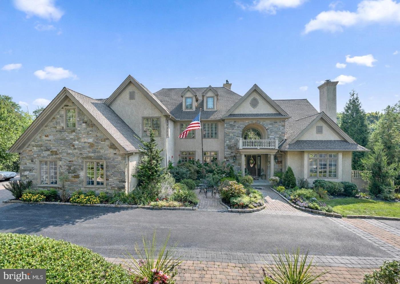 OPEN HOUSE SUNDAY, 7/12, 11-1. Welcome to 365 Arbor Circle, a beautiful estate home located in "The Arbors" neighborhood in popular Media. Custom built by master builder Jack Quinlen, this stately 6-bedroom, 9-bathroom beauty with an elevator, 5 CAR ATTACHED GARAGE and whole house generator redefines upscale living, offering a harmonious blend of impeccable design, amenities, & seamless blend of comfort and sophistication. As you enter, you're greeted by a grand 2-story foyer that sets the tone for the exquisite craftsmanship and attention to detail found throughout the home. The foyer is flanked by the formal dining room on the left and the living room with gas fireplace & tray ceiling on the right. Continue to the home office with cherry built-ins, amazing views and a wet bar connecting the office & living room with a formal half bath. The gourmet kitchen has been expanded & remodeled with high-end appliances, built-in refrigerator, dishwasher drawers (Bosch), beverage drawers, double ovens, gas cooktop, a warming drawer (all Wolf) and a large island. A butler’s pantry with wine fridge connects the kitchen and the dining room for seamless entertaining. The sunny breakfast room is adjacent to the kitchen with built-in cabinetry and a convenient desk. Off the kitchen is a huge Trex deck with retractable awning, ideal for alfresco dining. The cozy family room features a gas fireplace, built-ins and coffered ceiling, perfect for watching a movie on a chilly evening. A separate laundry room with a second refrigerator, casual powder room and 5 car attached garage complete this floor. The sellers installed Geothermal heating, which dramatically reduces utility costs. The second level includes 5 en-suite bedrooms. The primary suite is a sanctuary with a gas fireplace, tray ceiling, private balcony, sitting room, huge walk-in closet (with island) and a gorgeous bathroom with dual vanities, jetted tub, extra large shower and heated towel bar. Imaging relaxing in the jacuzzi tub with views of Ridley Creek! Also on this level is a private gym with back stairs to the mudroom area. There are 4 more spacious bedrooms, all with walk-in closets (with closet systems) and private bathrooms. The third level is well suited for overnight guests and features a separate suite with bedroom, full bathroom, and a living room. An elevator effortlessly connects the levels, adding a layer of seamless convenience, while the expansive 5-car attached garage (with lifts) provides ample space for car enthusiasts or multigenerational households. The heart of the home lies in its unparalleled entertaining spaces. The finished basement is nothing short of spectacular, designed to be the ultimate gathering place. Picture yourself hosting unforgettable Eagles parties at the full bar, whipping up culinary delights in the second kitchen, or enjoying movie nights in the state-of-the-art home theater. And when it’s time to relax, step outside to your own private resort—a heated in-ground pool and spa with outdoor fireplace, surrounded by lush landscaping, ideal for sun-soaked afternoons or serene evening dips under the stars. There is a large screened in porch under the deck with a view of the gorgeous pool.  Recent upgrades include refinished hardwood floors, fresh paint & new fixtures. Tucked away in a serene neighborhood backing up to open space and yet conveniently close to top-rated Rose Tree Media schools.  Just minutes away from the vibrant town of Media, with a myriad of restaurants, shopping and Dining Under the Stars. One can not build this home today at this price!
