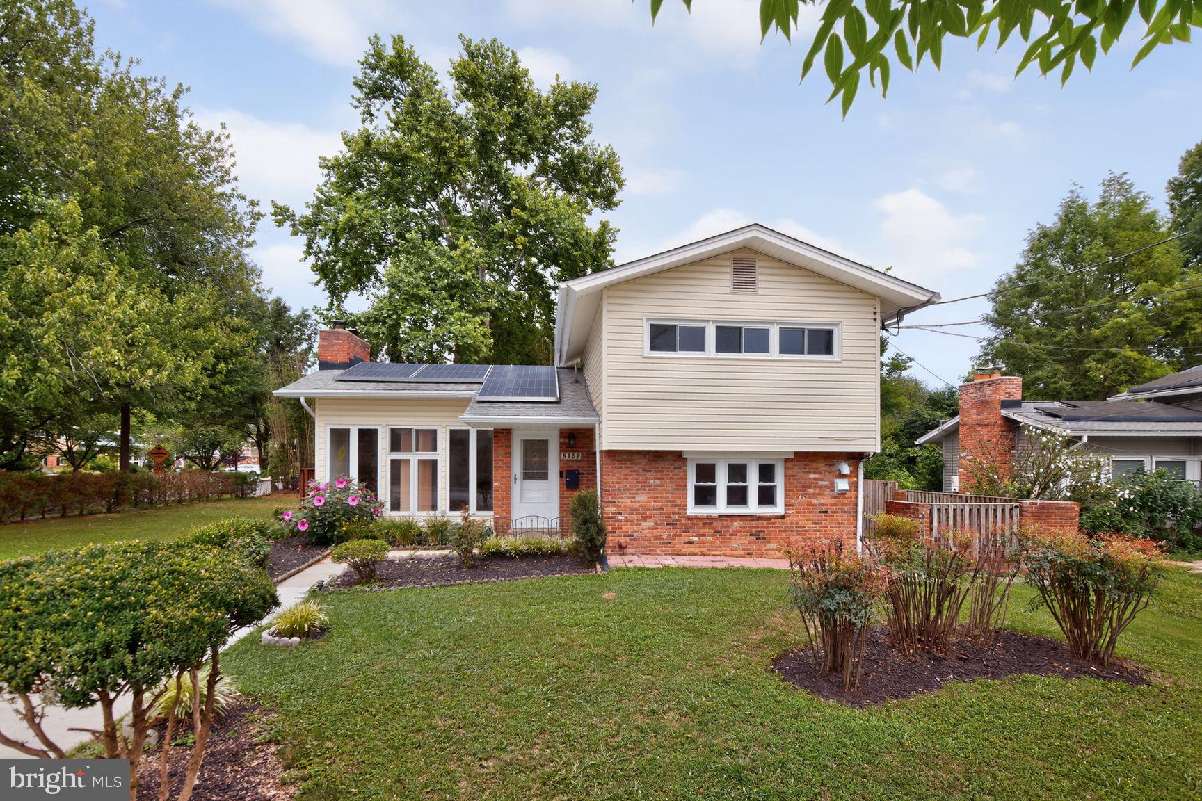 Amazing Rockville location! Spanning more than 3,000 square feet, this generous 5-bedroom, 3.5-bath home offers the rare convenience of two primary suites on the main level. Extensive updates throughout make this property truly move-in ready, including a newer 600-square-foot private brick patio designed for entertaining and everyday enjoyment, hardwood flooring throughout much of the home, and new flooring in the entryway, kitchen, utility room, and storage room. The chef’s kitchen has been thoughtfully remodeled with a center island, contemporary pendant lighting, generous storage, and direct access to the patio for effortless summer cookouts and gatherings. The bathrooms have been luxuriously renovated with elevated finishes, while the reimagined living and family rooms feature recessed lighting and refreshed flooring. A whole-house water filtration system delivers purified water to every fixture. The major systems have already been addressed, with windows replaced in 2021–2022 and the roof, HVAC system, and water heater updated in 2016. Owned solar panels were installed in 2016 following the roof replacement and are fully paid off, with no loans or liens, conveying free and clear to the buyer for immediate energy savings. An additional sump pump has also been installed in the crawl space for added protection and peace of mind. Inside, the sun-filled living room is anchored by a fireplace and transitions effortlessly into a warm family room with its own fireplace. A refined formal dining room opens through glass doors to the rear deck, which has been newly refaced with new boards and freshly painted, creating an inviting setting for outdoor dining and entertaining. Upstairs are three additional well-proportioned bedrooms with rich wood floors, along with a renovated bathroom featuring a corner walk-in shower and a spa-style soaking tub. The fully fenced backyard provides privacy for relaxing or entertaining, while the desirable corner lot offers perennial blooms, abundant storage, and convenient side parking. A bike trail directly in front of the property connects to the Rock Creek Trail system just a few blocks away, with playgrounds, basketball courts, and pickleball courts also nearby. Perfectly positioned in the heart of Downtown Rockville, the home is within walking distance of Twinbrook Metro Station and just steps from Twinbrook Library and Twinbrook Shopping Center, offering convenient access to groceries, dining, and shops, along with quick access to Route 355 and I-270.