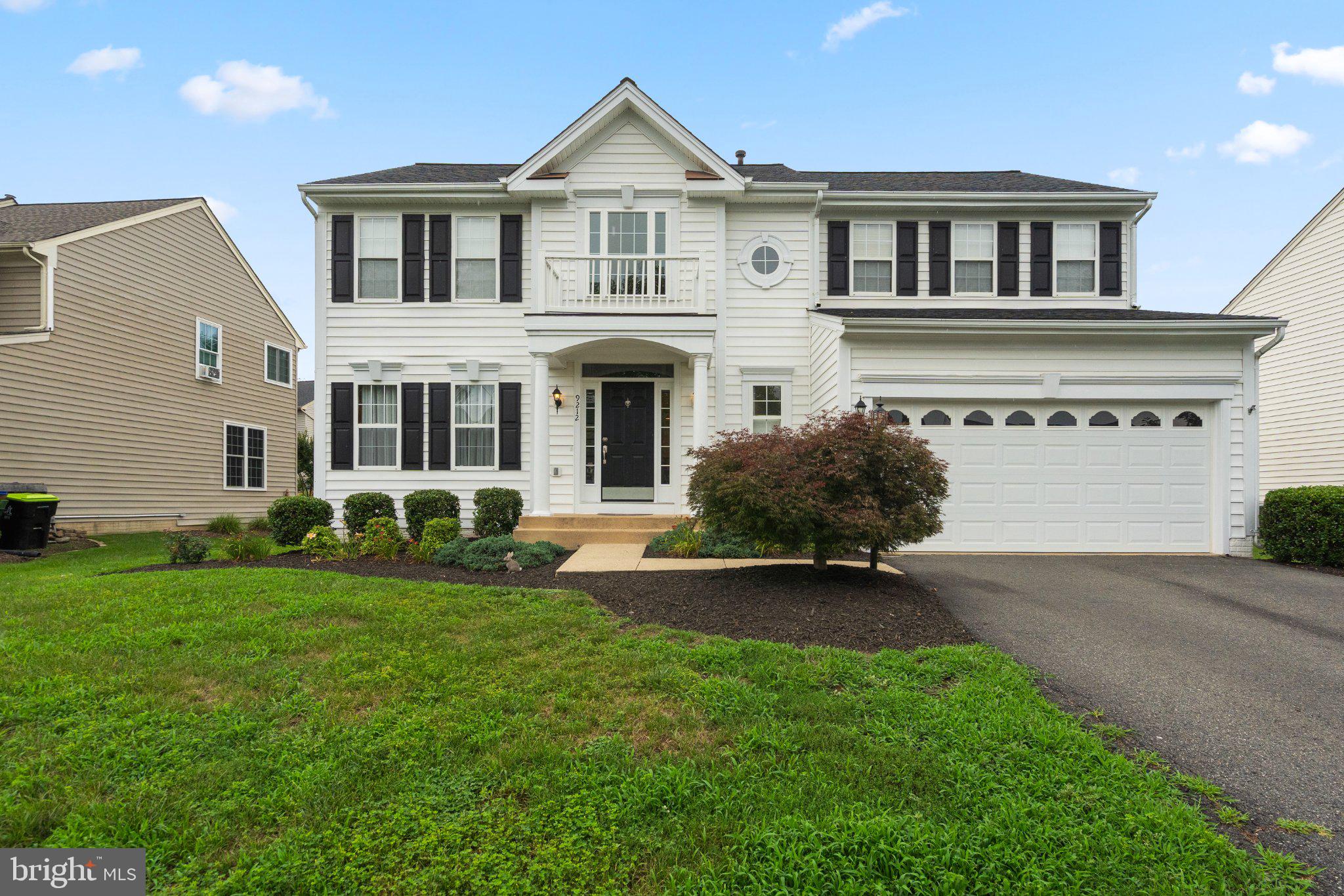 Major improvements: kitchen remodel (2024), water heater (2025), roof (2020), HVAC and furnace (2017), plus updated bathrooms staircase. 

Beautifully updated colonial in the sought-after Kingsbrooke community — four bedrooms, three and a half baths, a finished lower level, and one of the largest, flattest fenced yards in the neighborhood. Built in 1999 and improved thoughtfully over the years rather than flipped in a hurry. Classic white siding with black shutters, a columned portico, and mature landscaping deliver real curb appeal from the moment you arrive.

Inside, a dramatic two-story foyer is anchored by a completely reimagined staircase with warm wood treads and wrought-iron balusters. Wide-plank flooring runs throughout the main level, connecting a formal living room and separate dining room, both finished with crown molding and classic chair railing. Tall windows and custom drapery keep these rooms bright and refined, with an easy flow that makes holiday hosting effortless while preserving distinct, purposeful spaces.

At the heart of the home is the fully remodeled 2024 kitchen. Crisp white shaker cabinetry stretches to the ceiling, paired with quartz countertops, a subway tile backsplash, and a deep navy island that grounds the room with a custom, designer feel. Stainless appliances and generous prep surface make weeknight cooking as pleasant as weekend entertaining. The kitchen opens to a sunlit breakfast area with sliding glass doors to the patio, then flows into the family room, arranged around a gas fireplace with a traditional white mantel. Windows on two exposures keep it bright all day, with dedicated space for a main-level office nook — a quiet corner to work without sacrificing a bedroom.

Upstairs, the primary suite is a genuine retreat: hardwood flooring, a soaring vaulted ceiling, and windows on multiple walls, with room for a full bedroom suite and a sitting area besides. The en-suite bath delivers a true spa experience — a freestanding soaking tub beneath plantation-shuttered windows, an oversized frameless glass shower with river-rock pebble floor, dual granite vanities, a private water closet, and large-format tile throughout.

Three additional bedrooms are well-sized with bright windows and generous closets, sharing a beautifully updated hall bath with a quartz-topped vanity, matte black fixtures, and a fresh subway-tiled tub surround. Bedroom-level laundry with built-in shelving adds everyday convenience.

The finished lower level expands the living space considerably — a wide-open recreation area with luxury vinyl plank flooring, recessed lighting, and daylight windows, easily configured as a game room, media space, gym, or playroom. A full bath makes it equally suited to overnight guests or extended family, with ample storage remaining.
Outside is where this property separates itself. An oversized irregular flagstone patio — natural bluestone, not stamped concrete — steps down from the breakfast room, offering a substantial footprint for outdoor dining and grilling. Beyond it stretches an exceptionally large, level, fully fenced backyard: genuinely usable green space for games, gardening, pets, and play, framed by mature evergreens for privacy. Yards like this are increasingly hard to find.

Kingsbrooke offers exceptional amenities including a community pool, tennis courts, and a playground. Minutes to Gateway Promenade town center's dining, shopping, and entertainment, with easy access to Route 66, Linton Hall Road, and the Broad Run VRE station.
Move-in ready, mechanically current, and offering the rare combination of updated interiors and a big, flat, private yard. Welcome home!