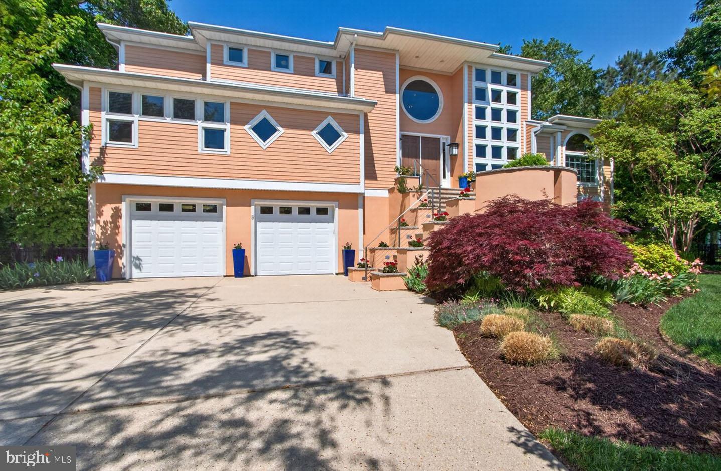 Tucked within one of the most exclusive communities in Rehoboth Beach – Canal Corkran, this extraordinary custom-built residence is a masterclass in luxury, architectural artistry, and refined coastal living. Spanning approximately 4,440 square feet, this stunning 5-bedroom, 4.5-bath home offers an atmosphere of sophistication, where soaring ceilings, dramatic architectural windows, and thoughtfully curated finishes create an unforgettable living experience. From the moment you arrive, the home’s magnificent curb appeal commands attention. Mature landscaping, ornamental trees, beautifully contoured grounds, and striking architectural design create a private and unforgettable first impression. Situated on a spacious corner lot, the property’s elevated outdoor living spaces provide exceptional privacy while enhancing the home’s seamless indoor-outdoor flow and resort-like ambiance. At the heart of the home lies a truly one-of-a-kind pool experience that sets this residence apart from anything else in Rehoboth Beach. Positioned directly off the main living areas, the elevated lap pool becomes the visual centerpiece of the home — perfectly framed from the dining room, kitchen, great room, and sunroom. Recently rebuilt with sophisticated lighting, architectural glass tile accents, and a pergola spanning its length, the pool deck delivers an unparalleled sense of tranquility and luxury. The elevated design not only creates a dramatic architectural focal point but also offers a remarkable level of privacy rarely found in coastal living. The grand interior design is complemented by elevator access to all three levels, offering both convenience and accessibility throughout the home. The great room is nothing short of spectacular, featuring soaring ceilings, curated designer lighting, a stunning gas fireplace with an impressive travertine surround, and walls of windows that flood the space with natural light. French doors throughout the main level create effortless transitions to the outdoor entertaining areas and pool deck, blurring the line between indoor elegance and outdoor retreat.
Occupying the entire third floor, the primary suite is more than just a bedroom — it is a private sanctuary. Designed with comfort and luxury in mind, the suite features extensive custom built-in cabinetry, a cozy gas fireplace, spacious sitting area, private sun porch, expansive walk-in closet with dedicated laundry, and a spa-inspired ensuite bath complete with heated floors, a soaking tub, and an oversized walk-in shower. Designed for both serious culinary enthusiasts and effortless entertaining,  the custom German-engineered SieMatic kitchen is a showpiece of form and function. Sleek custom cabinetry, intelligent storage solutions, and a spacious walk-in pantry are paired with commercial-grade appliances including Thermador and Miele offerings, dual ovens, warming drawer, pot filler, oversized island, and elegant yet low maintenance Silestone countertops. Every detail has been meticulously considered to create a culinary space that is as functional as it is striking. Additional luxury features include a temperature-controlled wine cellar with approximately 700-bottle capacity, integrated audio system, architectural lighting, cable railings, security system with cameras, UV-protected windows, multiple fireplaces, heated bathroom flooring, custom window treatments throughout, multiple laundry areas, and a spacious flex room on the ground level ideal for a fitness studio, workshop, or additional recreation space. This is a rare and superb opportunity for the discerning Rehoboth Beach buyer seeking a one-of-a-kind luxury retreat that effortlessly combines architectural significance, exceptional craftsmanship, resort-style amenities, and unparalleled privacy in one of coastal Delaware’s most coveted communities.