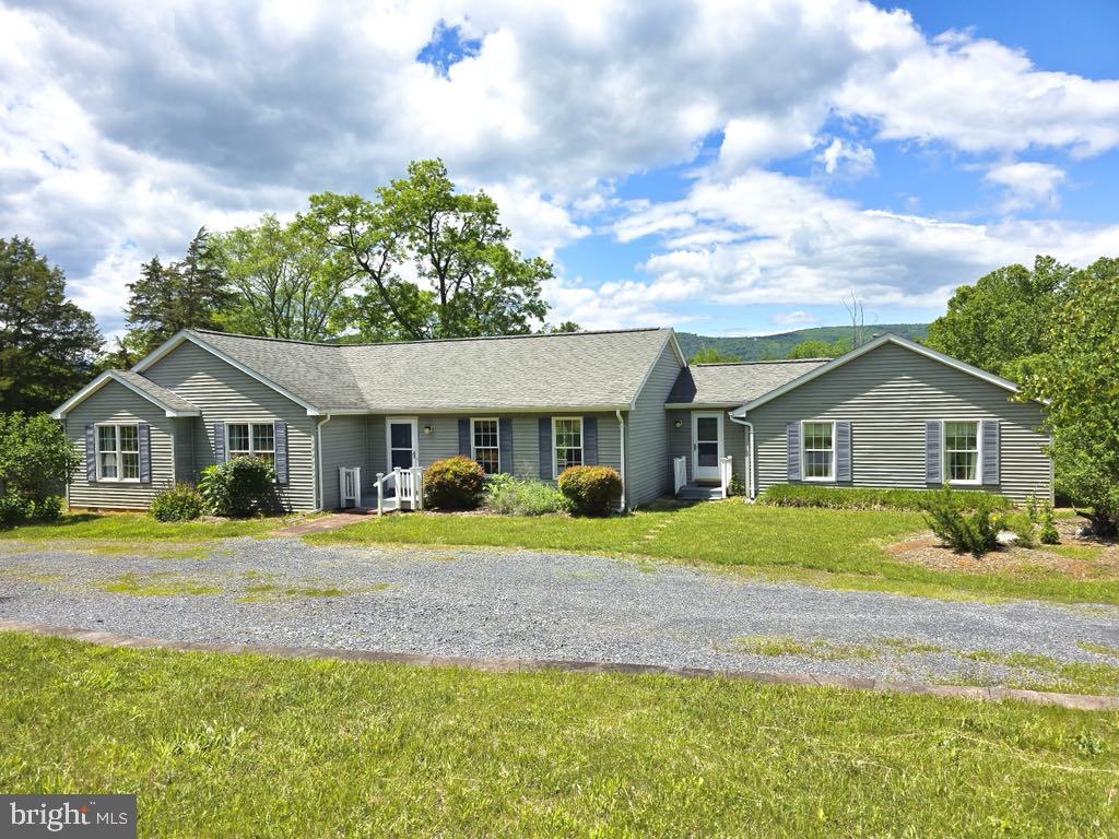 Charming Ranch with Scenic Views on Nearly 2 Acres

Welcome to this inviting 3-bedroom, 2-bath ranch-style home nestled on 1.83 acres in the heart of Maurertown. Offering 1,976 square feet of living space, this well-maintained property boasts a spacious layout, abundant natural light, and stunning mountain views.

The home features a bright and open living area, a well-appointed kitchen, and a generous primary suite. Enjoy peaceful mornings on the front porch or relax in the expansive yard with plenty of room for gardening, play, or pets.

One unique feature of this property is the large attached space that was once a two-car garage—now converted into a versatile workshop or potential bonus area. This space  offers ample opportunity for customization to suit your needs, whether you envision a home studio, gym, actual garage, or additional living area.

Situated on a quiet country road yet conveniently close to town amenities, this home combines privacy and practicality. Don’t miss your chance to make this serene Shenandoah Valley retreat your own!