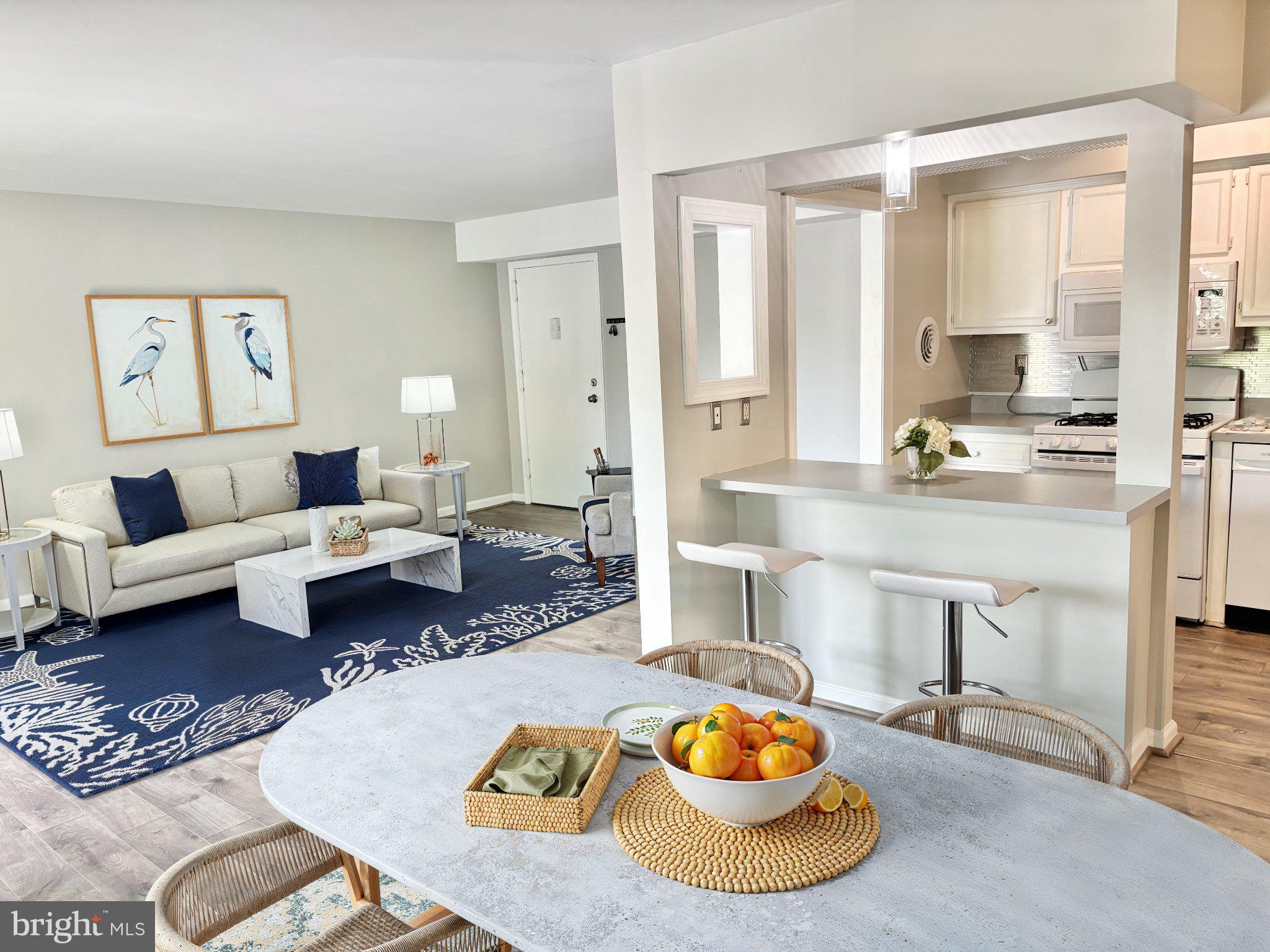 Welcome to Fairwinds of Annapolis, this delightful 2nd floor 2-bedroom, 2-bathroom garden condo offers a perfect blend of comfort and convenience. (Furnace 2021) The open kitchen floor plan invites you to experience a warm and inviting atmosphere, ideal for entertaining over the breakfast bar. Natural light floods the living spaces, creating a cozy ambiance. The neutral kitchen features a built-in microwave, a Brand NEW (dishwasher 2026), and gas oven/range, making meal preparation a joy. Enjoy casual dining in the dedicated dining area or unwind in the spacious living room. The entry-level bedroom provides easy access and privacy, while the primary suite boasts a generous walk-in closet dressing area and ensuite bathroom, with ample storage for all your needs. Step outside to discover a vibrant community with amenities that enhance your lifestyle. Walk to the grocery store and coffee shops. Enjoy sunny days at the outdoor pool, engage in friendly matches on the tennis courts, or take leisurely strolls along the jogging paths. The association takes care of maintenance, including lawn care and snow removal, allowing you to focus on what truly matters. With convenient in-unit laundry facilities and off-street parking, this home is designed for modern living. Experience the perfect blend of comfort, community, and convenience in this inviting residence. **Pet Friendly** Don't miss the opportunity to make it your own! Condo fee includes Gas heating and cooking, water & sewer. Just 2.8 miles to the United States Naval Academy and 10min bike ride to beautiful historic downtown waterfront.