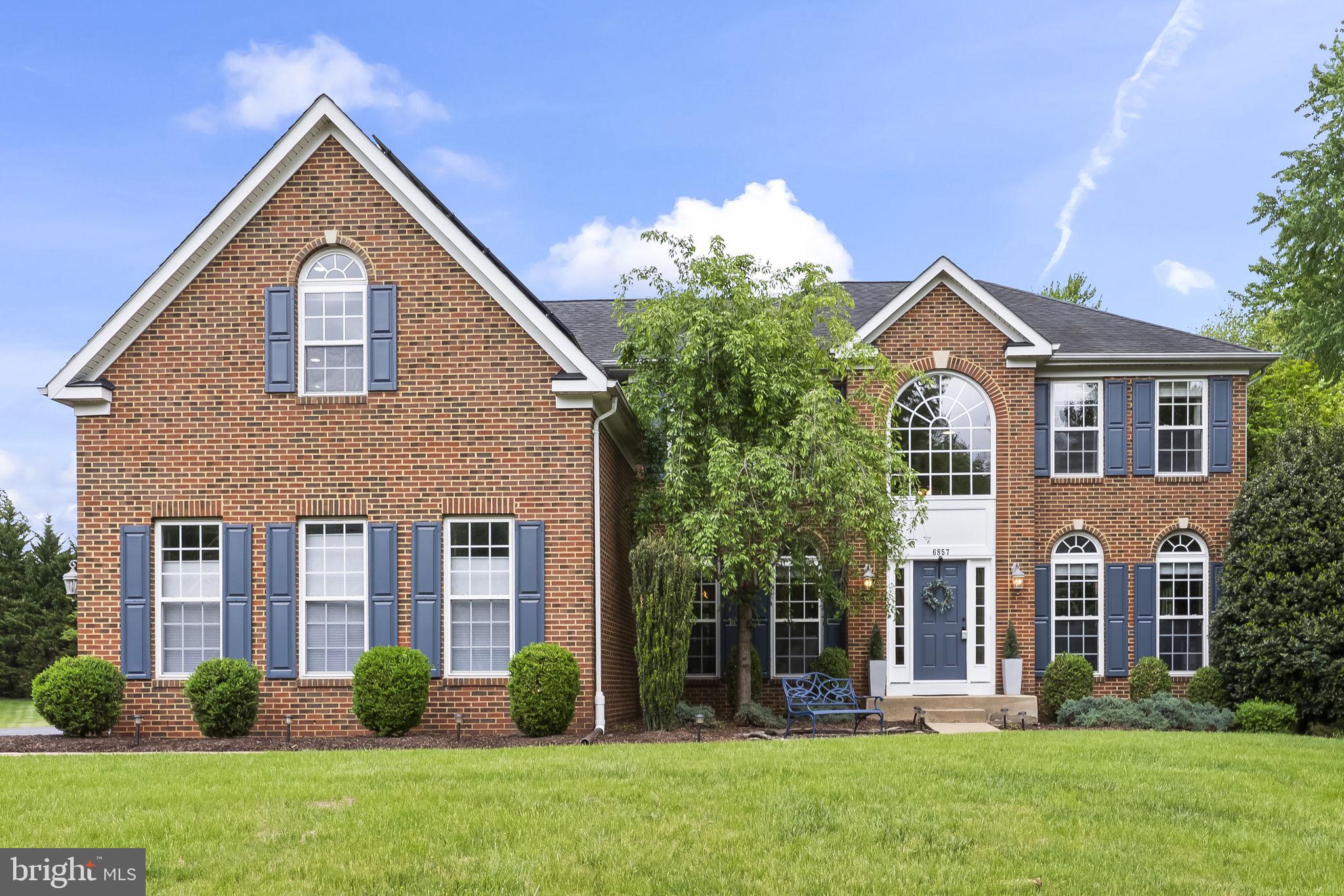 Gorgeous home in a premier ammenity filled community on the DC side of Warrenton. On almost a full acre lot, this brick fronted home overlooks a huge backyard which is shaded all afternoon, whether on the deck or in the screened porch.  This home has over 5200 sq ft of finished space on 3 levels.  It has 5 BRs and 3 1/2 baths. There is a legal BR in the basement, which is a full walkout, so it is always light and inviting.  It's a flexible suite for guests with a full bath and spacious food prep area.  The main level is big and open, 2 story family room,  bright sunroom for eating or lounging and it leads to the wonderful screened porch.  The  kitchen with many recent updates overlooks it all.  There are lots of other spaces and rooms to accomodate the life the way you want it.  Huge owner's suite upstairs, with so much closet space and luxury bath, plus 3 other BR's.
There's a 3 car garage, fully owned solar panel system, 2 zoned heating/cooling systems, one was just replaced.  There's so much to see and too much to tell you about, so come on over and see it ......... FYI, agent is related to the Seller