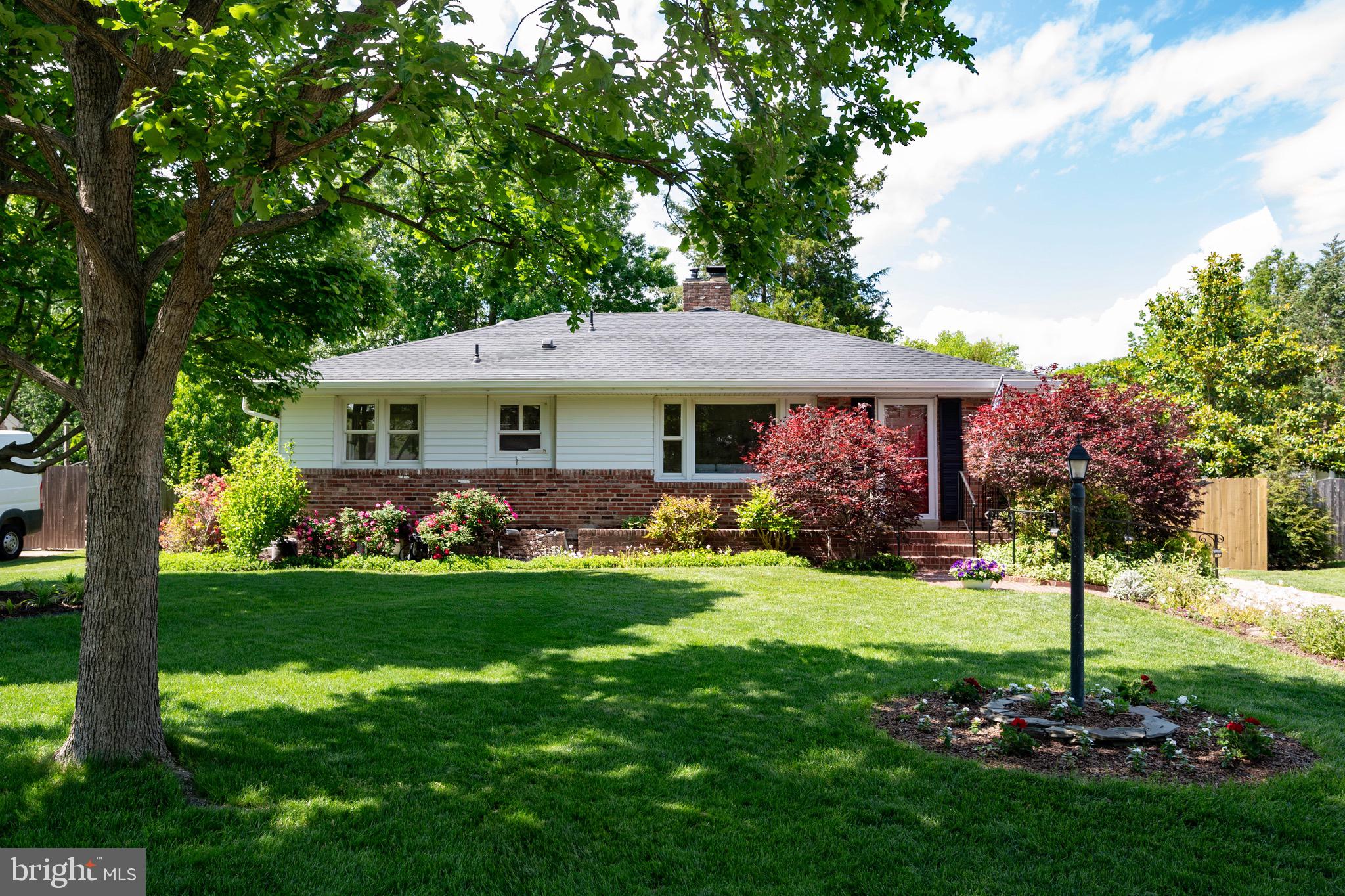 This beautifully updated and expanded two-level rambler in Hollin Hall Village offers the perfect blend of charm, comfort, and convenience. Located in the highly sought-after Waynewood Elementary School district, the home features four bedrooms and three full bathrooms, with all bedrooms situated on the main level. The primary suite addition offers an en-suite bathroom and peaceful views of the patio and lush backyard. The main level also showcases newly refinished hardwood floors, a spacious living area with a wood-burning fireplace, a dining space, and a bright kitchen with newly refaced cabinets, new microwave & fridge, new dishwasher 2024, ample counter space, and generous storage.

Downstairs, the expansive lower level provides an ideal entertaining space along with a third full bathroom, a laundry and work room, and abundant storage. A few steps up from the lower level lead to the fully fenced backyard, a haven for relaxing, entertaining, or gardening—with strawberries nearly ripe and pears and figs soon ready to harvest.

Additional updates include a replaced roof and gutters in 2024 and energy-efficient double-pane windows. The home’s location is truly unbeatable—just a short walk to the Hollin Hall Shopping Center, which includes a Safeway, hardware store, pastry shop, variety store, and several dining options. Outdoor lovers will appreciate easy access to the George Washington Parkway and Mount Vernon Bike Trail, while commuters benefit from proximity to Fort Belvoir, Huntington Metro, and Old Town Alexandria. This home truly offers the best of neighborhood living with modern updates and exceptional convenience.