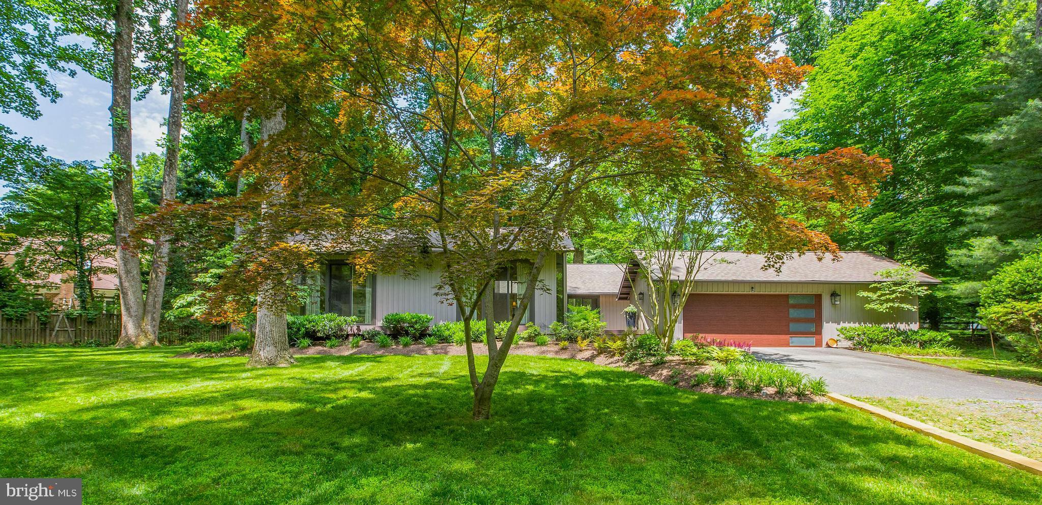 LOCATION IS EVERYTHING!!  Welcome to this Meticulously Maintained and Move-In Ready 4 | 2.5 single family home on a .53  Acre lot in a highly sought-after Potomac neighborhood.  This magnificent Mid-Century Modern custom home has been immaculately maintained and you will easily recognize the Pride of Ownership.  When you first arrive you will notice the Privacy afforded by the Large Manicured lawn with mature trees and oversized parking for easily hosting events.  Upon entering the open foyer of the home you immediately feel at peace and sense of serenity .  The whole house has an abundance of natural light beginning with the living room where you can relax in front of the fireplace while keeping an eye on dinner cooking in your renovated gourmet kitchen. A true Chef's dream with top of the line appliances, amazing storage and counter space galore you'll never want to eat out again . Moving away from the kitchen, this home boasts a separate formal dining room with access to an outside deck.  The family room is perfect for movie night or board games with built in shelves and surround sound. This home also boasts a Primary Bedroom with ensuite full bathroom and walk-in closet, three additional spacious bedrooms 1 additional full bathroom and a half bath off of the foyer.  Need room for bikes, paddleboards & sports equipment?  We’ve got you covered-there’s an oversized 2 car garage with a workbench area, shelves lining the walls and upper loft storage   you'll never run out of room for storing all your toys, tools and much more.  Added plus w with this property being just over an half  Acre is that it offers sufficient space to host all your family events and neighborhood gatherings!  Enjoy all seasons on the stunning oversized updated decks overlooking your private, spacious yard w/established landscaping in this charming neighborhood.
