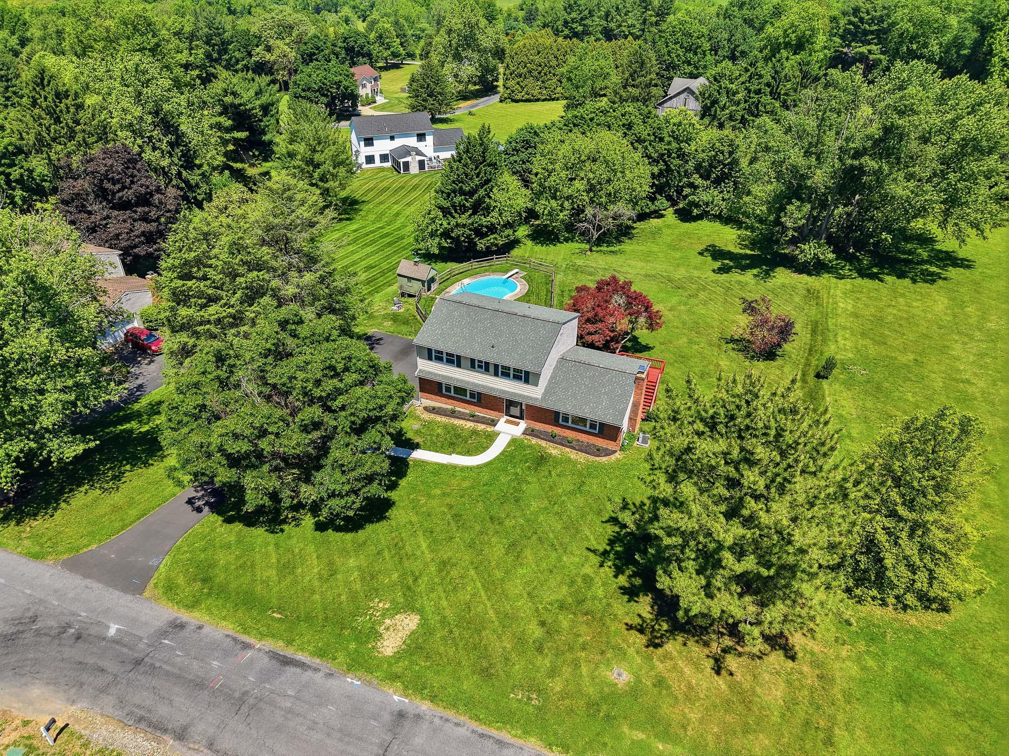 YES! Believe your eyes: it's nearly impossible to find a four bedroom home, on an acre of land, with an INGROUND POOL at this price point! Welcome to 111 Skyline Drive - you will LOVE living here. This traditional Colonial-style home is situated in the bucolic rolling hills of Landenberg, in the Skyline Drive neighborhood - think tree-lined, close-knit without being on top of each other; your neighbors are just friends you haven't met yet. This home features beautiful hardwood floors throughout, a living room and a family room (extra living space!) both on the first floor, as well as an adorable half bathroom off the kitchen. and all 4 bedrooms are upstairs! You've got an updated hall bathroom upstairs and the primary bedroom has an en suite. The basement is unfinished and clean; it already has a half bathroom.. ready for you to finish to add value and still have space for extra storage. Along the basement is your attached 2 car garage. You'll be pleased to learn there's no major HOA here dictating how you update and customize your property. The homeowners have invested in MANY major system updates recently: The roof is from 2022, new doors installed in 2024 and 2026, almost all the windows were replaced in 2025, there's a new garage door and pool filter, and the driveway and walkway were completely rebuilt in 2024! Schedule your tour today and see in person how much there is to love about 111 Skyline Drive. Showings scheduled to begin Friday evening, June 5. 
*professional photos being taken and will be added the first week of June! Reach out to AMANDA FALES 302 898 3153 of the Janes Team with questions or interest.