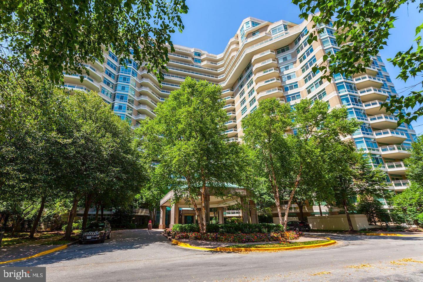 Somerset House 2 -- one of the 3 sought after Somerset  Condominium buildings sited on approximately 16 acres of lush designer gardens and greenery.   Breathtaking panoramic views welcome you to this elegant two bedroom, two and a half bath penthouse offering 2,200 square feet of luxury living.  An exciting floorplan provides an entry foyer and two extended hallway foyers with ample space for the art collector.  The sunny, light filled living room opens to a large balcony, and is open to the library/second bedroom/office complete with wet bar and private full bath.  Enjoy cocktails on the balcony which is accessible from both rooms.  On the right side of the apartment an extended foyer leads to the formal dining room and sunny table space kitchen complete with laundry.  On the left wing of the apartment, one finds the guest powder room,  two large walk in closets, built ins galore and a hallway dedicated to the primary suite.  The primary bath includes double sinks, a jacuzzi tub, and walk in shower.   The primary bedroom is oversized with space for a desk area, and the entire primary suite opens to the extended balcony. Floor to ceiling doors and windows allow for superb light filled mornings and afternoons. Somerset offers the finest in condominium living.  Along with a gated security guardhouse, each building has two doormen, two front desk personnel, onsite manager and assistant manager and an entire team of engineers.  Somerset House 2 has a recently renovated entertaining room and catering kitchen on the main level.  Service extraordinaire is the hallmark of Somerset House living.   The three story clubhouse, accessible through the garage , provides for large entertaining rooms, a boardroom for meetings, card room, full service gym, indoor pool, sauna rooms and more.   Located conveniently a few blocks from the Friendship Heights Metro,  the best of shopping and a great array of local restaurants.  2 assigned garage spaces and 1 storage unit complete this offering.