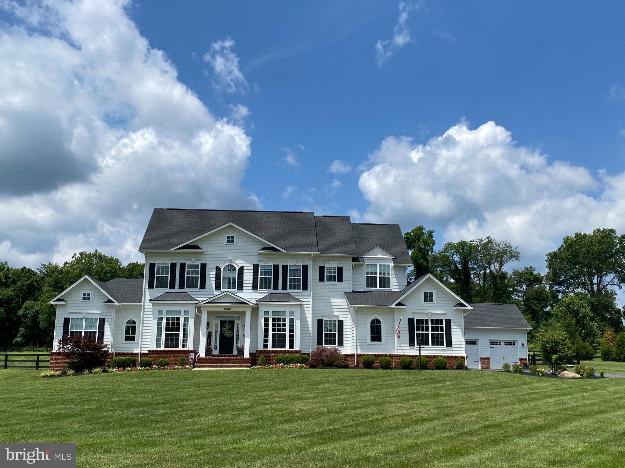 Discover refined living in this stunning Craftsman-style residence in western Loudoun, offering nearly 6,000 square feet of luxury and comfort. Thoughtfully designed for modern living, this home delivers the perfect balance of elegance, functionality, and natural beauty.

The open, light-filled layout flows seamlessly from the welcoming foyer into the heart of the home. The gourmet kitchen is a showstopper, featuring premium countertops, a large center island, and four ovens, including a professional Bertazzoni 6-burner Italian range with griddle - a chef’s dream come true. The large kitchen offers space for casual dining (including space at the island for four barstools), while a separate formal dining room provides an elegant setting for entertaining.

The spacious family room is warm and inviting, anchored by a gas fireplace and detailed with a coffered ceiling The main-level owner’s suite offers ultimate convenience and privacy, complete with his and hers closets and a spa-inspired bath with designer finishes. Upstairs, three large bedrooms provide generous space for family or guests.

Built by Carrington Homes in 2019, this residence showcases exceptional craftsmanship and timeless quality throughout. The fully finished basement adds versatility, featuring a large rec room with built-in bar, large bedroom suite with ensuite bath, gym, bonus/flex room and three separate storage rooms. 

Step outside to enjoy three peaceful acres with a fully fenced backyard, large screened-in porch, and expansive deck, perfect for outdoor gatherings or quiet evenings surrounded by nature. A five-car garage (three attached and two detached) provides ample space for vehicles, hobbies, and storage.

Ideally located in the heart of Virginia wine country, this home offers the best of both worlds; serene country living with easy access to award-winning vineyards, charming small towns, and major commuter routes. Elegant, spacious, and impeccably crafted, this Black Oak Ridge residence embodies the very finest in Virginia luxury living.