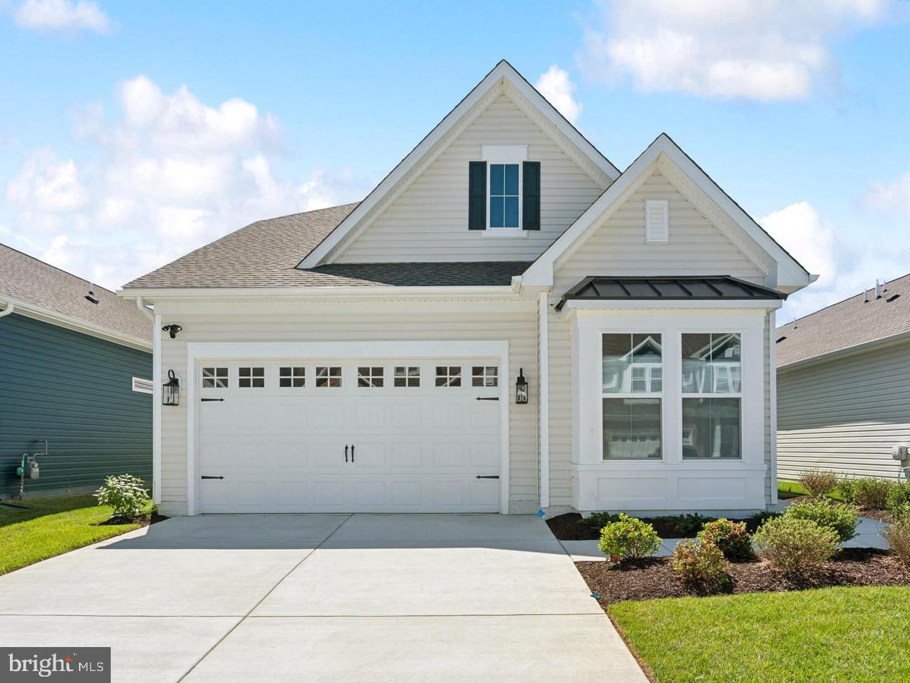 Welcome to the Simone, a beautifully designed home offering 4 bedrooms, 3 baths, and a 2-car garage. This home combines thoughtful design with comfortable living spaces ideal for both everyday life and entertaining.

The main living area features a cozy one-story fireplace, creating a warm and inviting focal point. A dedicated home office provides a private space for work or study, while the screened patio extends your living area outdoors—perfect for relaxing or hosting guests.

The kitchen is designed for both style and function, featuring a single oven, microwave, gas cooktop with range hood, dishwasher, French door refrigerator, pendant lighting, tile backsplash, and quartz countertops. Quartz is also featured in the owner’s bath for a cohesive and elegant finish.

Luxury vinyl plank flooring runs throughout the foyer, extended foyer, kitchen, dining area, great room, bedroom 2, owner’s suite, HovHall, loft/second floor, and bedrooms 3 and 4. Tile flooring is featured in all full baths and the laundry room. The owner’s bath includes a walk-in shower with a seat and handheld shower wand, along with a double-sink vanity for added comfort and convenience.

For a full list of features for this home please contact our sales representatives. 
Photos are for illustrative purposes only and may not represent the exact home or finishes available.

Welcome to a new luxury active adult 55+ community on Maryland's Chesapeake Bay. Discover the amenity-filled, resort-style experience within 45 miles of Washington DC and Baltimore. Residents can take advantage of the community's 24,000 sq. ft. clubhouse with indoor & outdoor pools, a state-of-the-art fitness center, and multiple tennis and pickleball courts. With a full-time lifestyle director on site the community also features a well-maintained calendar of activities such as walking club, indoor and outdoor yoga sessions, mahjong club, kayaking, pickleball and more. Kent Island life is about making friends and enjoying the company of people who have worked hard and now want to enjoy all that a luxury 55+ community has to offer. Located steps from the water and minutes from Annapolis, the location also offers quick access to Rt. 50. Enjoy the convenience of nearby dining and shopping options together with the quaint charm of a small town.